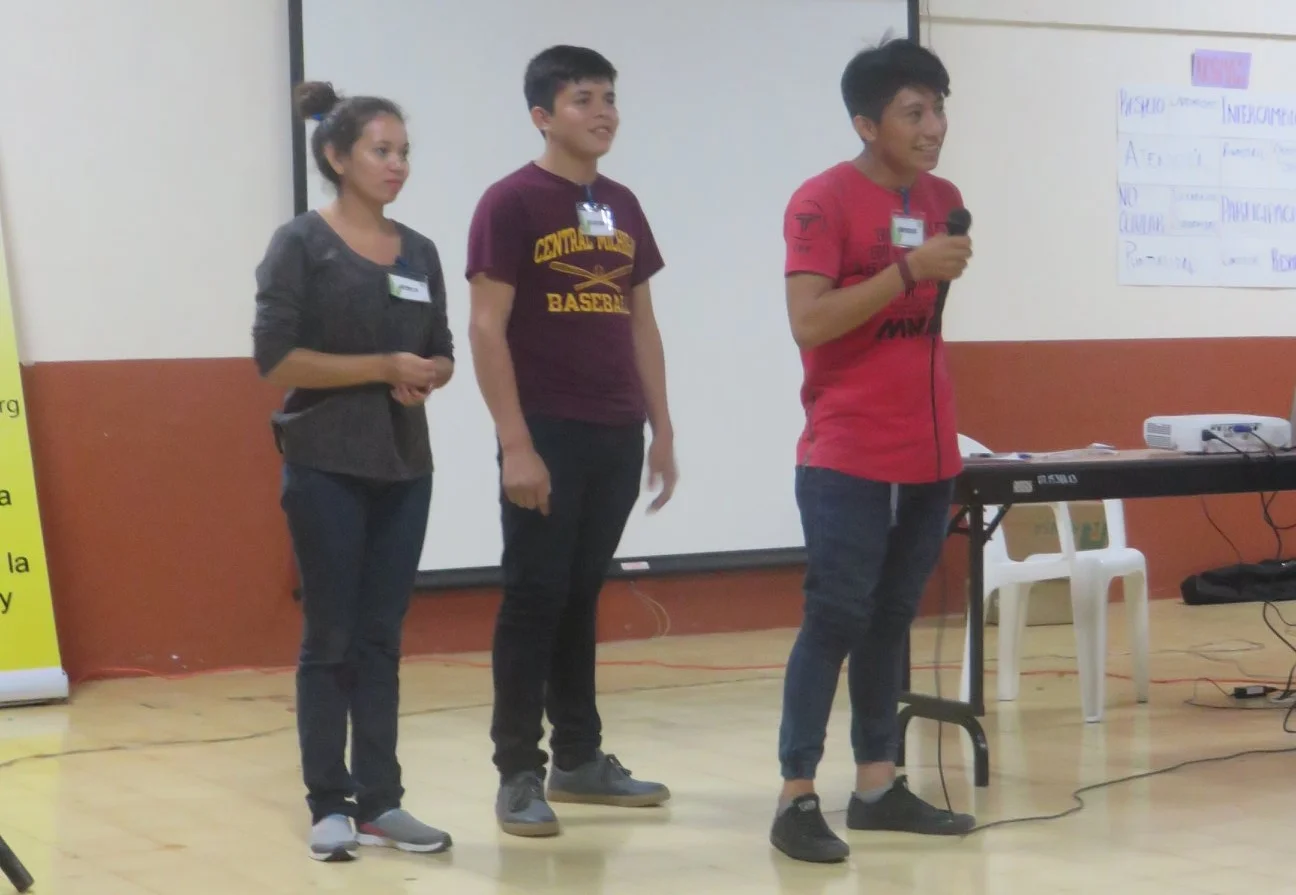 CdA Scholarship students Jessica Idalia, Brayan, and Noel present at the Centro de Intercambio y Solidaridad's annual scholarship student retreat.&nbsp;