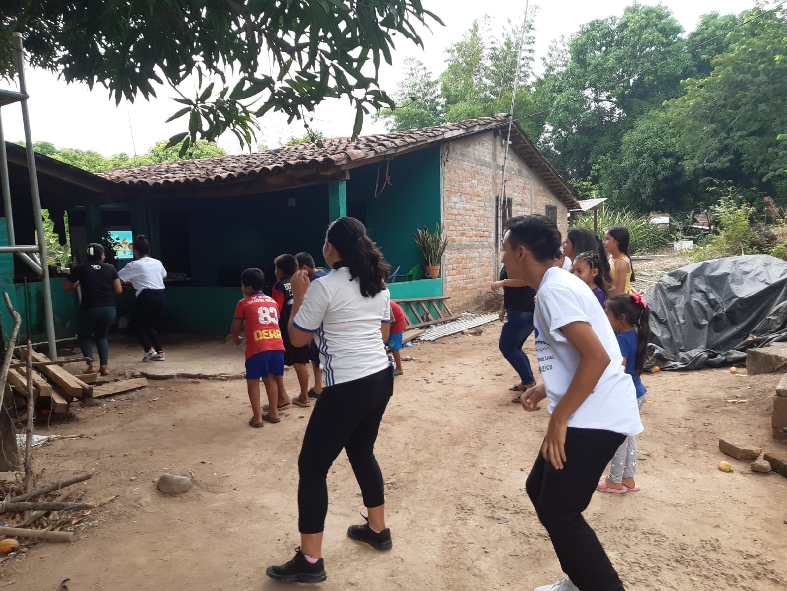 Scholarship Students dancing with Members of the CAS