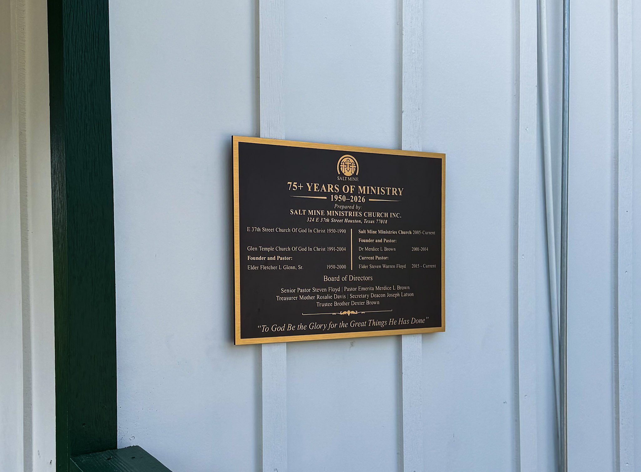 Custom commemorative plaque celebrating more than 75 years of Salt Mine Ministries Church, mounted on the exterior of the building.