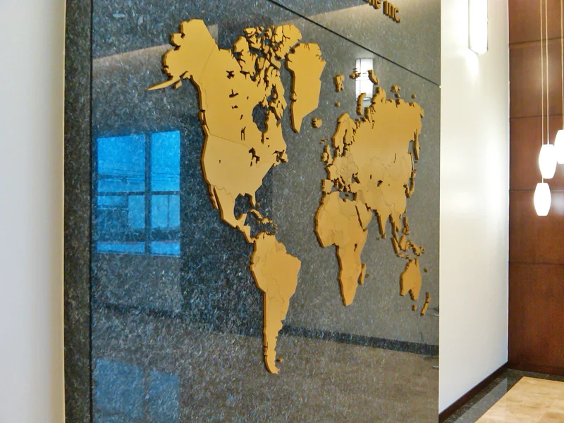 The Atlas (close up) - A Map of Countries of the World with Company Logo in 3/4" and 1/2" Thick Anodized Gold Aluminum Pieces