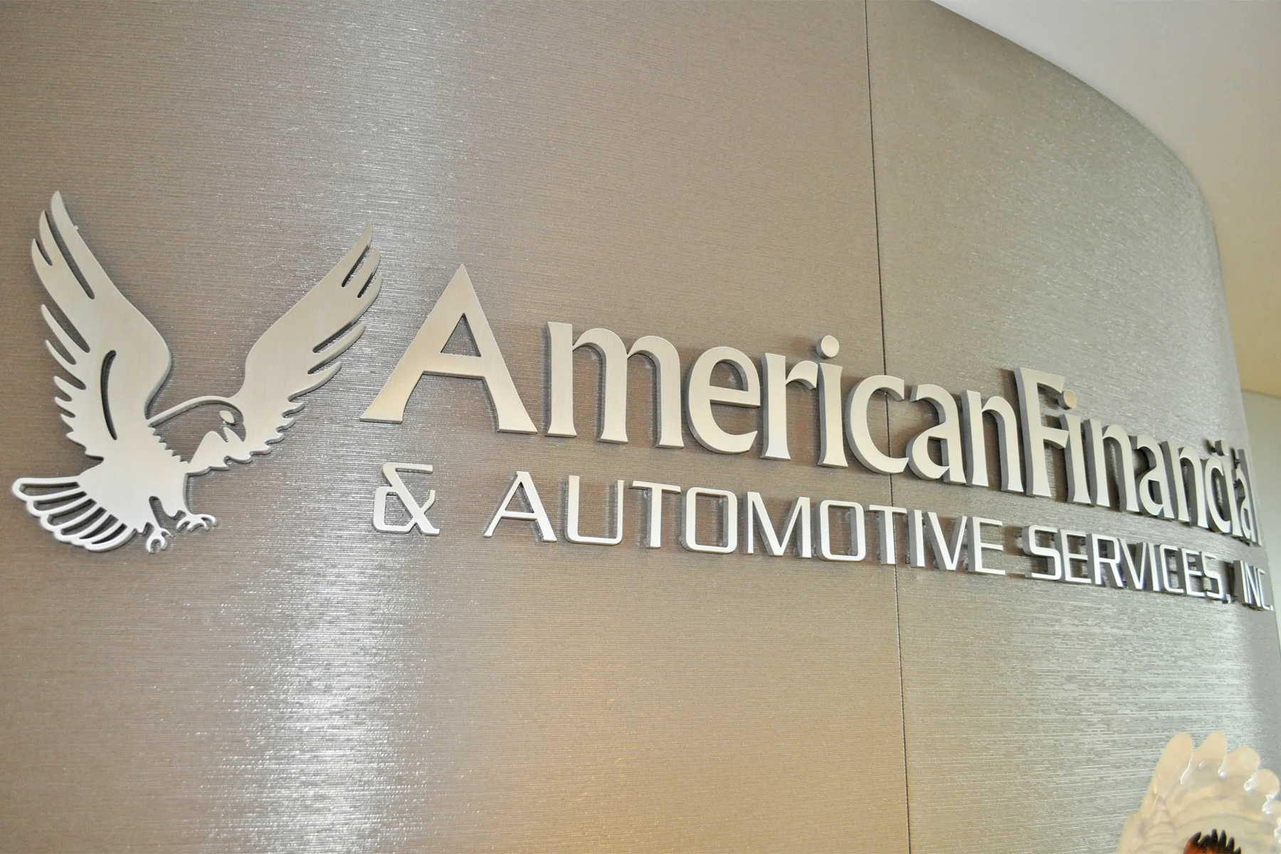 Curved Interior Sign (close up) - Drilled Stud Mounts give a Floating Effect, Accented by Nice Shadows from Office Lighting