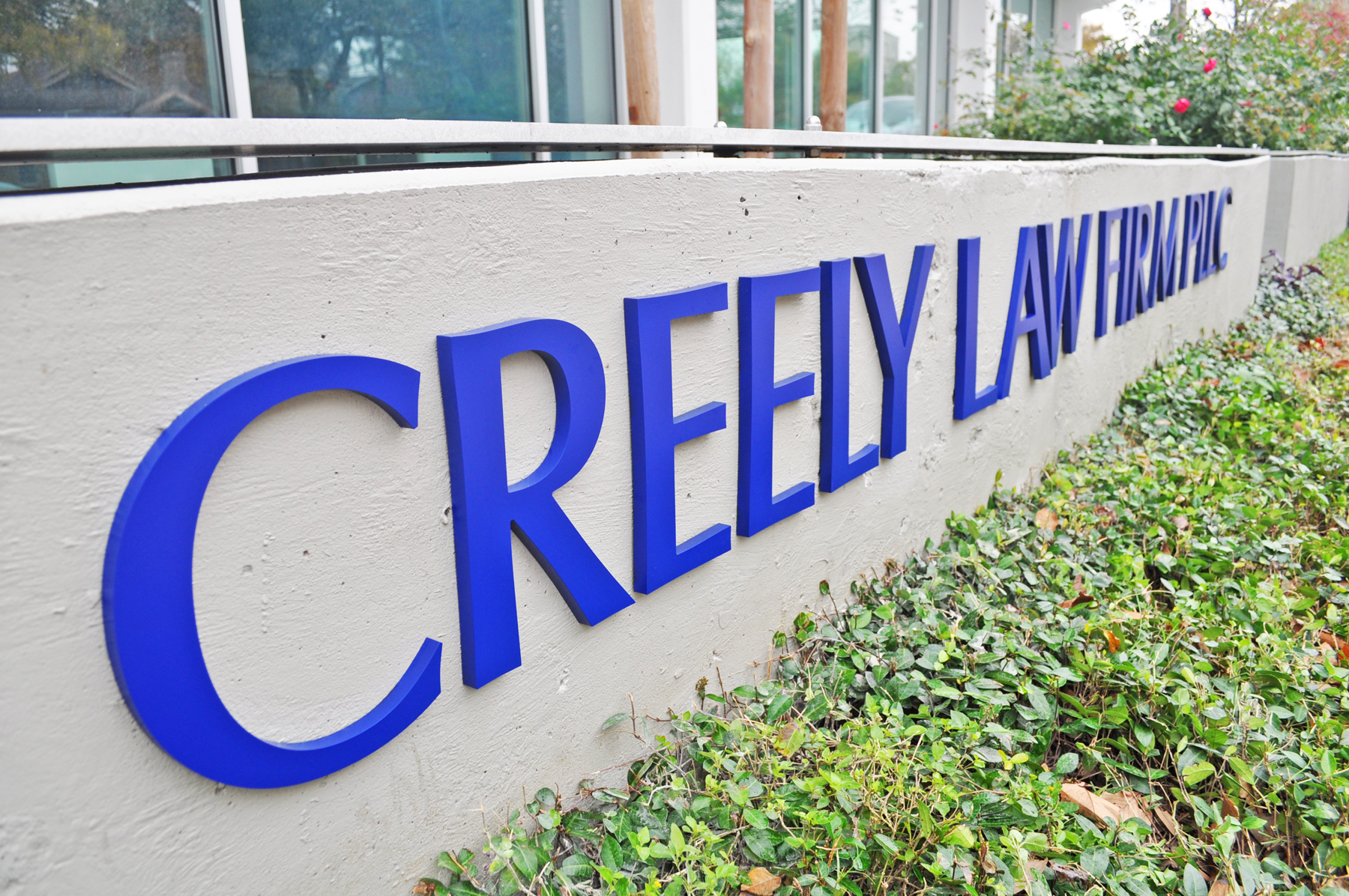 Concrete Wall Monument - 1/2" Thick Custom Laser Cut Acrylic Letters Flush Mounted with Studs