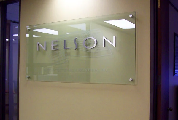 Glass Signage with Brushed Aluminum Letters and Etched 3D Design for Nelson Architectural Engineers, Austin, Dallas, San Antonio, Houston TX