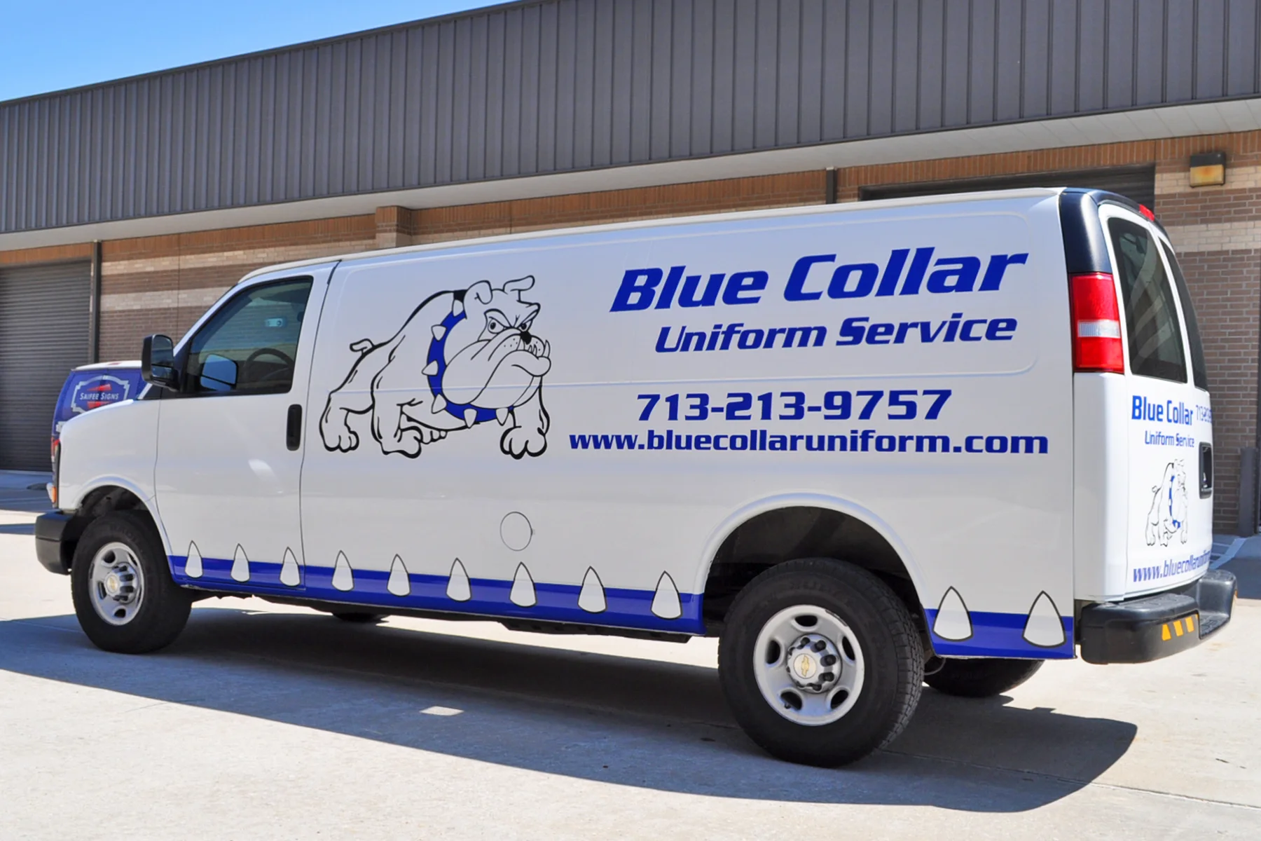 Neatly Designed Vinyl Graphics on a Cargo Van for a Uniform Rental Company