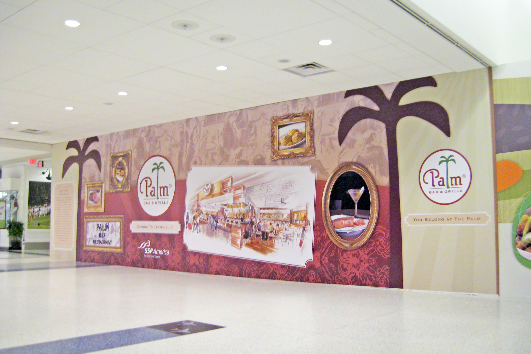 Photo Murals at the Airport for an Upcoming Restaurant Grille - Custom Designed and Printed Wall Paper Graphics provide Useful Advertising while Stores are Under Construction