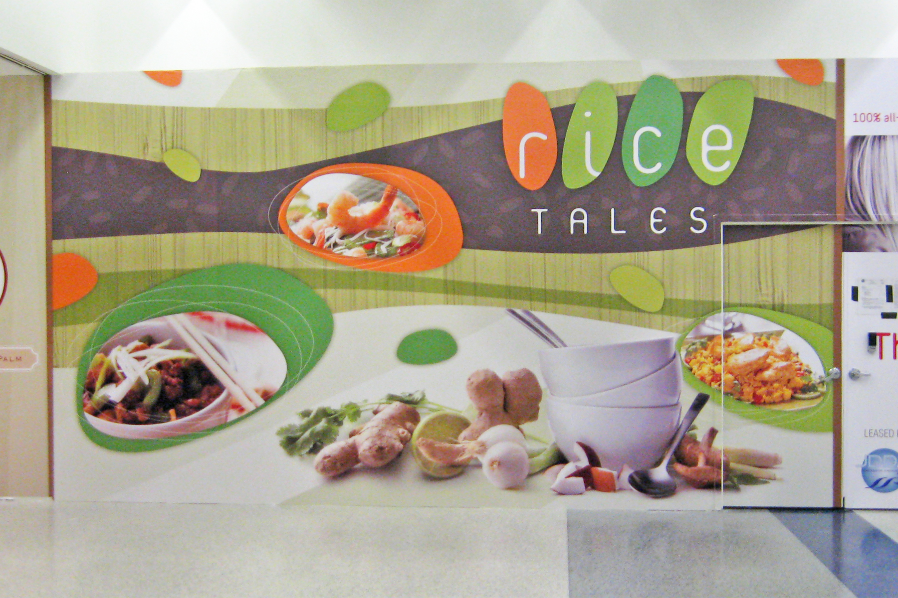 Barricade Wall Graphics at the Airport for an Upcoming Restaurant - Custom Designed and Printed Wall Wraps provide Useful Advertising & Colorful Wall Art while Stores are Under Construction