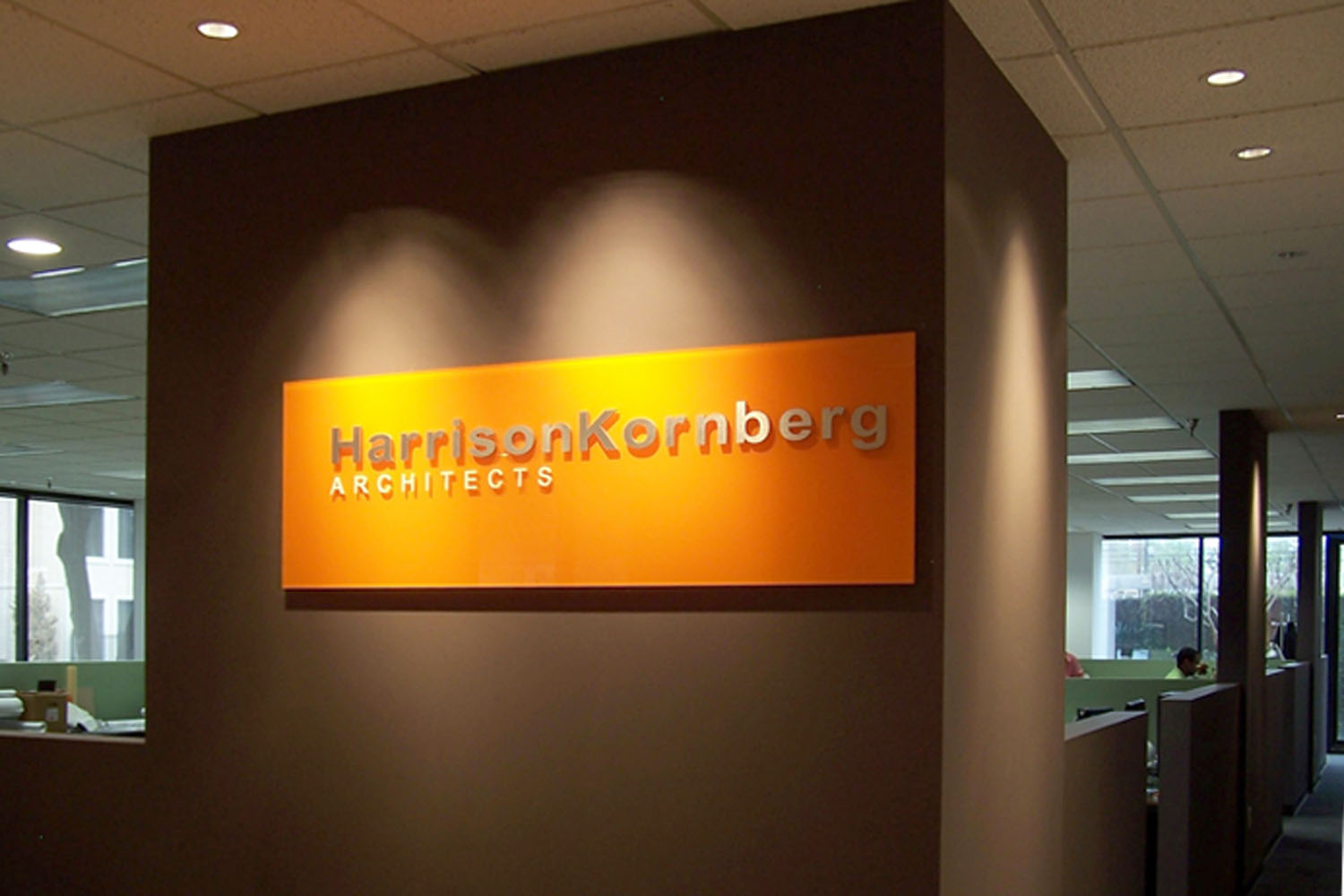 Interior Office Sign with a Custom Painted Matte Finish Orange Back Plate for Harrison Kornberg Architects, Houston TX