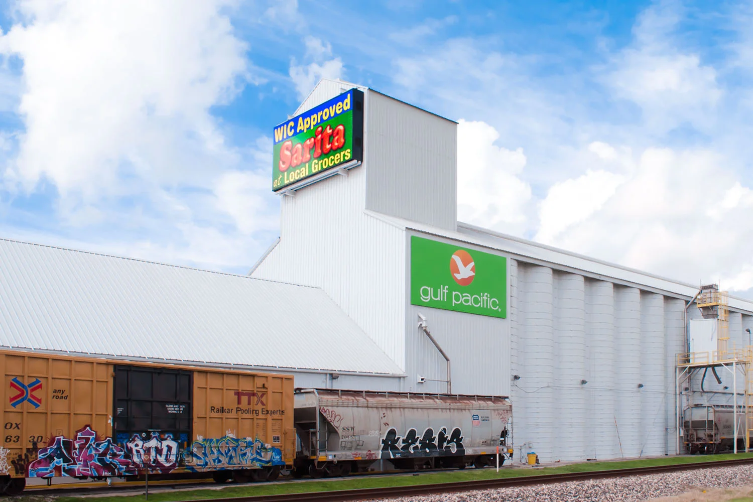 Large Outdoor Signs for Industrial Complexes - How a Rice Company Maximises its Advertising Using 5 Large Pan Signs on the Perimeter of this Hwy 290 Property