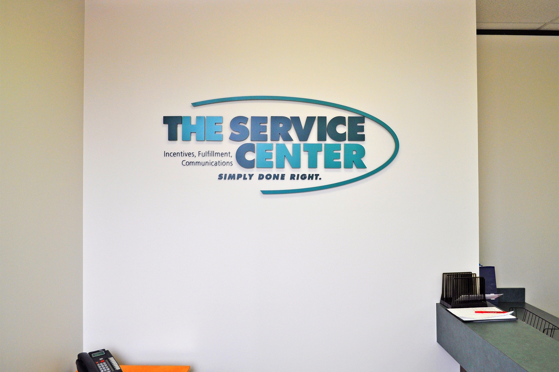 Custom Lobby Sign with Large Oval Curve and Multiple Tag Lines