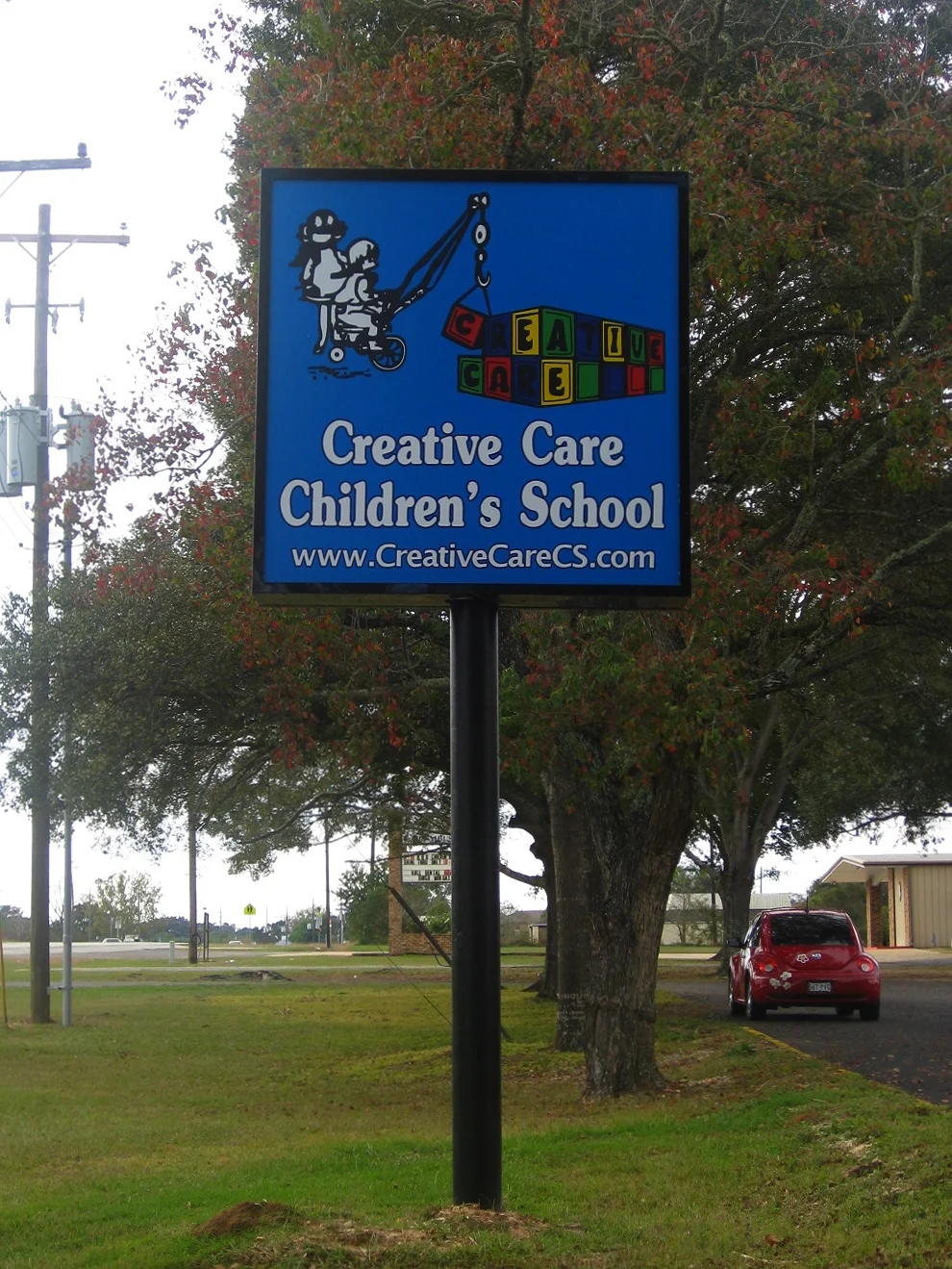 Compact Pole Sign with Custom Square Cabinet to Accommodate Logo Layout