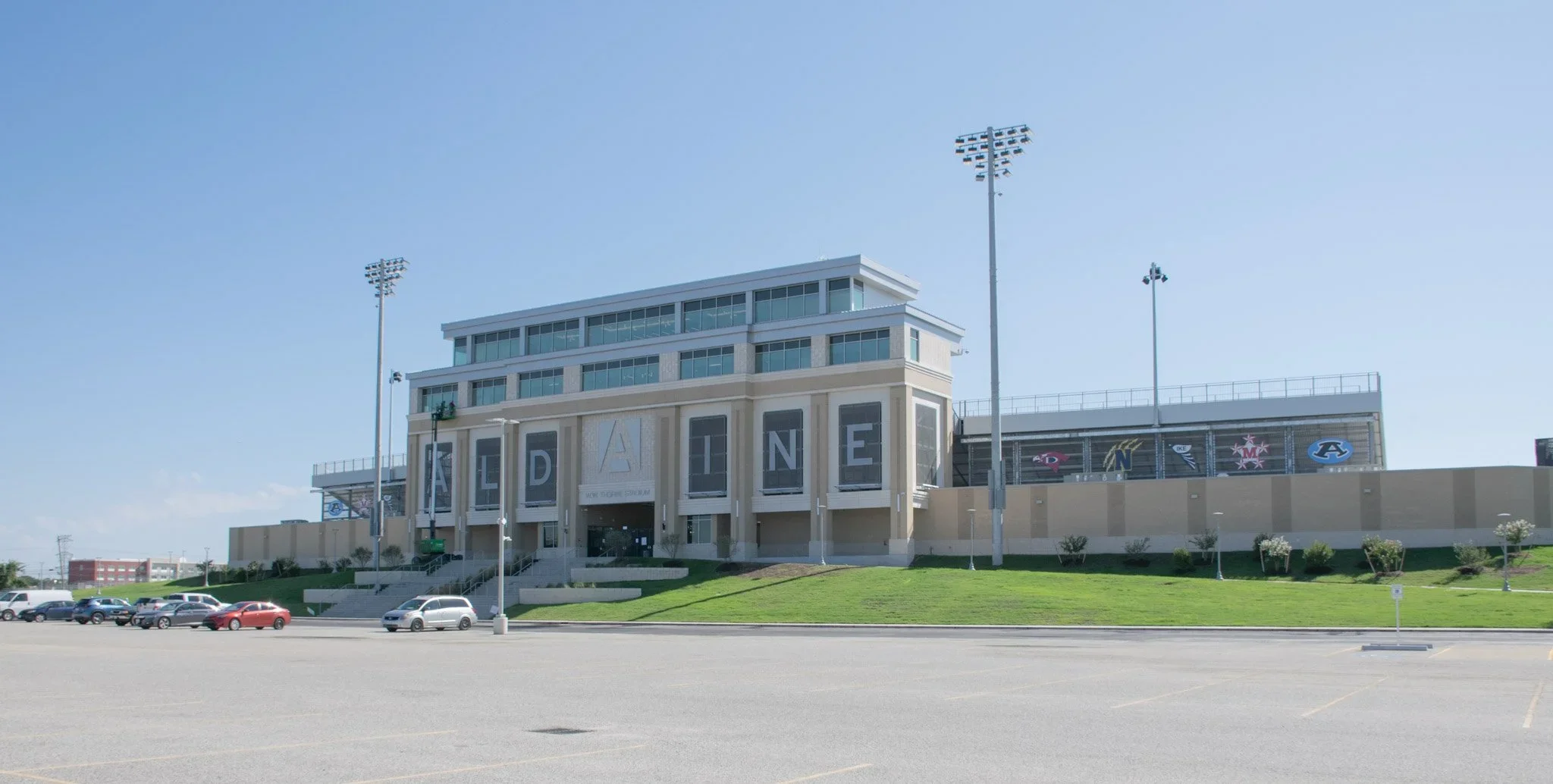 Houston stadium signage at W. W. Thorne Stadium in Aldine ISD featuring large-scale architectural lettering on a sports facility facade.