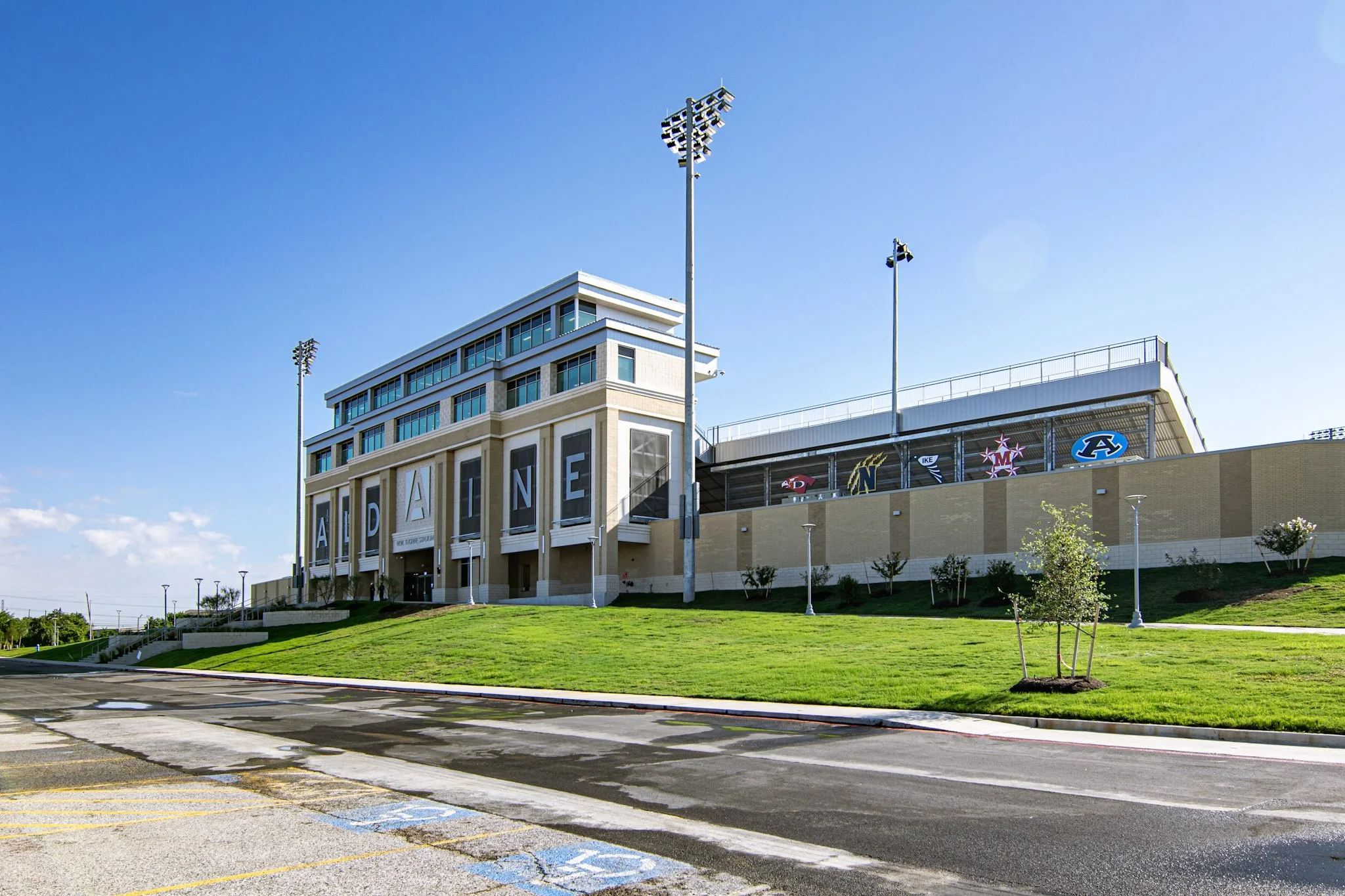 ACM signage with digitally printed school branding installed at W.W. Thorne Stadium for Aldine ISD in Aldine, Texas.