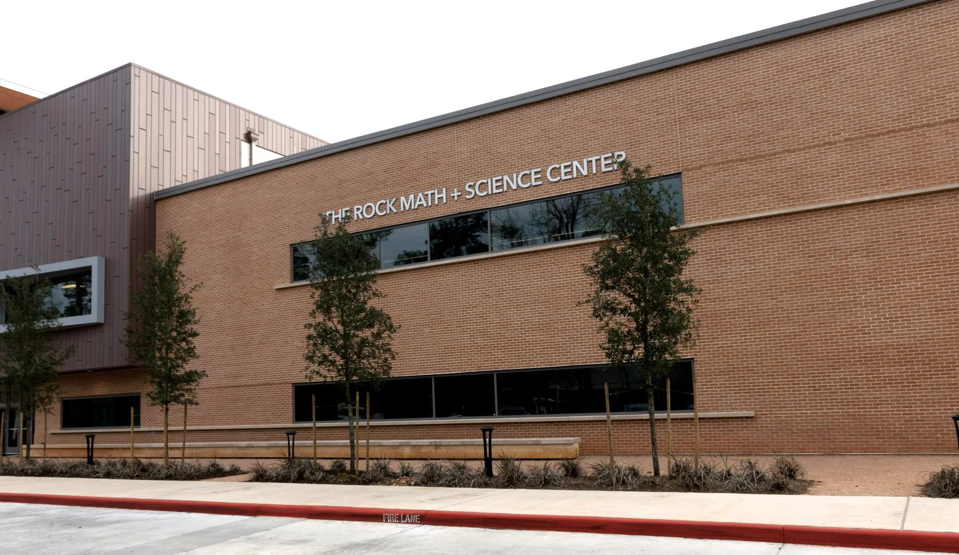 Custom exterior dimensional letter signage for THE ROCK MATH + SCIENCE CENTER at The John Cooper School in The Woodlands, Texas.