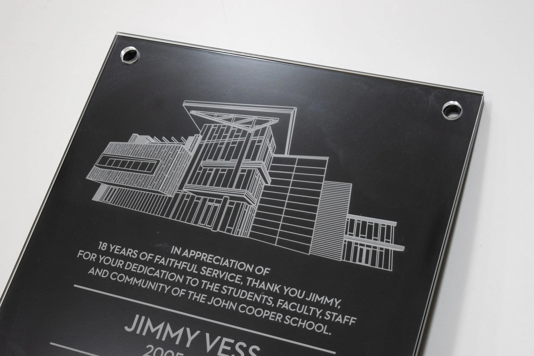 Custom etched glass donor recognition sign featuring architectural artwork and engraved dedication text for The John Cooper School.