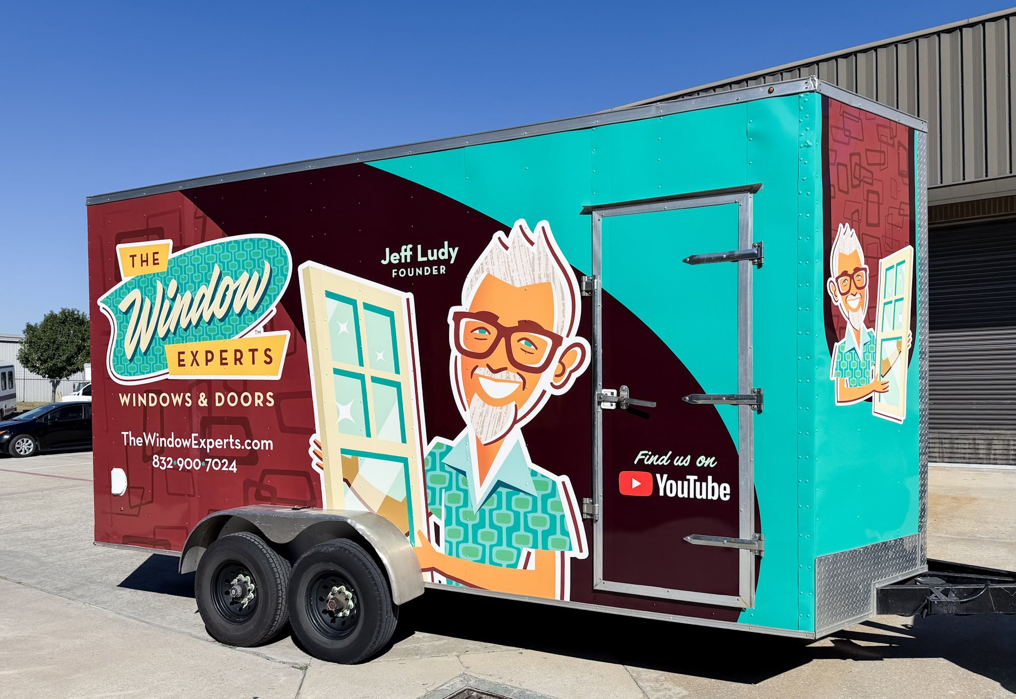 Commercial trailer wrap for The Window Experts featuring teal and burgundy graphics, company logo, illustrated character, website, and phone number.