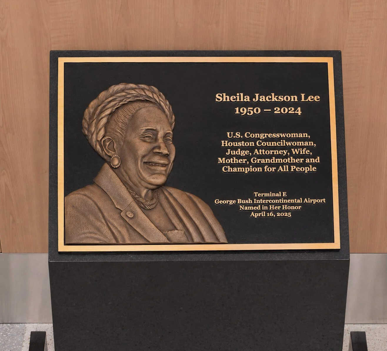 Cast bronze memorial plaque honoring Sheila Jackson Lee displayed inside George Bush Intercontinental Airport.