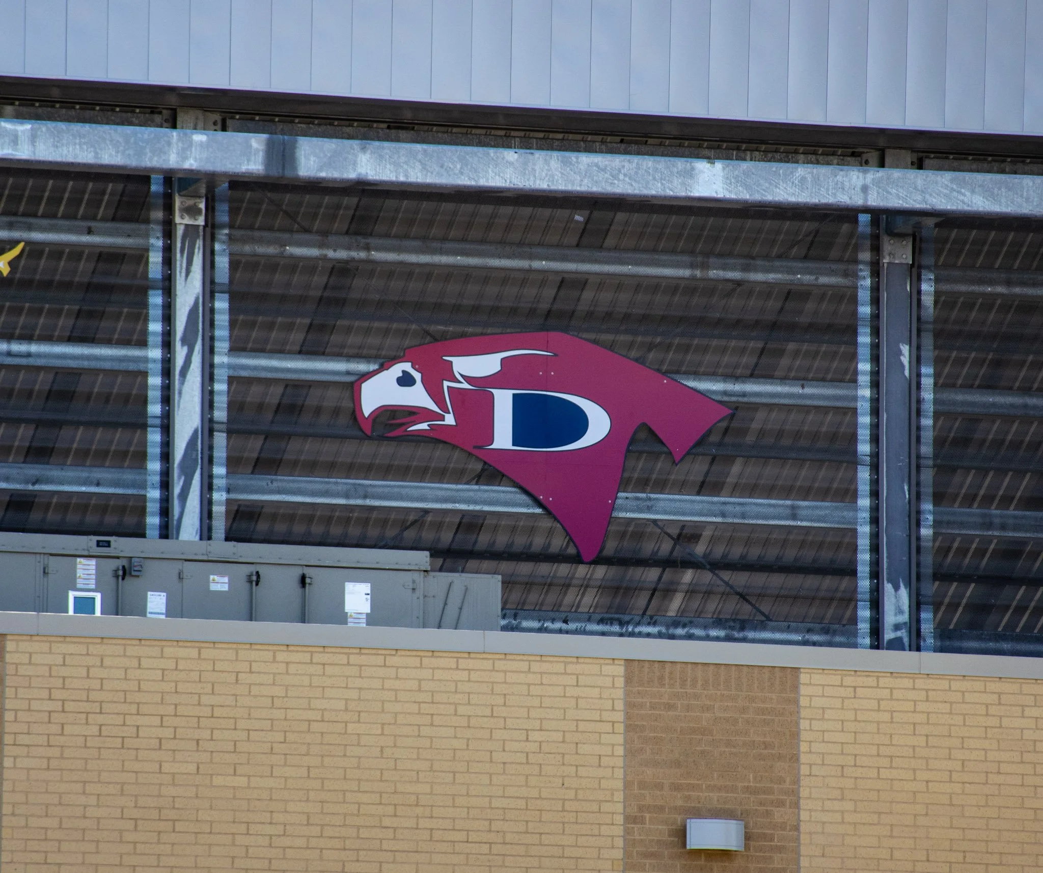 Digitally printed ACM Davis High School logo signage installed at W.W. Thorne Stadium for Aldine ISD in Aldine, Texas.
