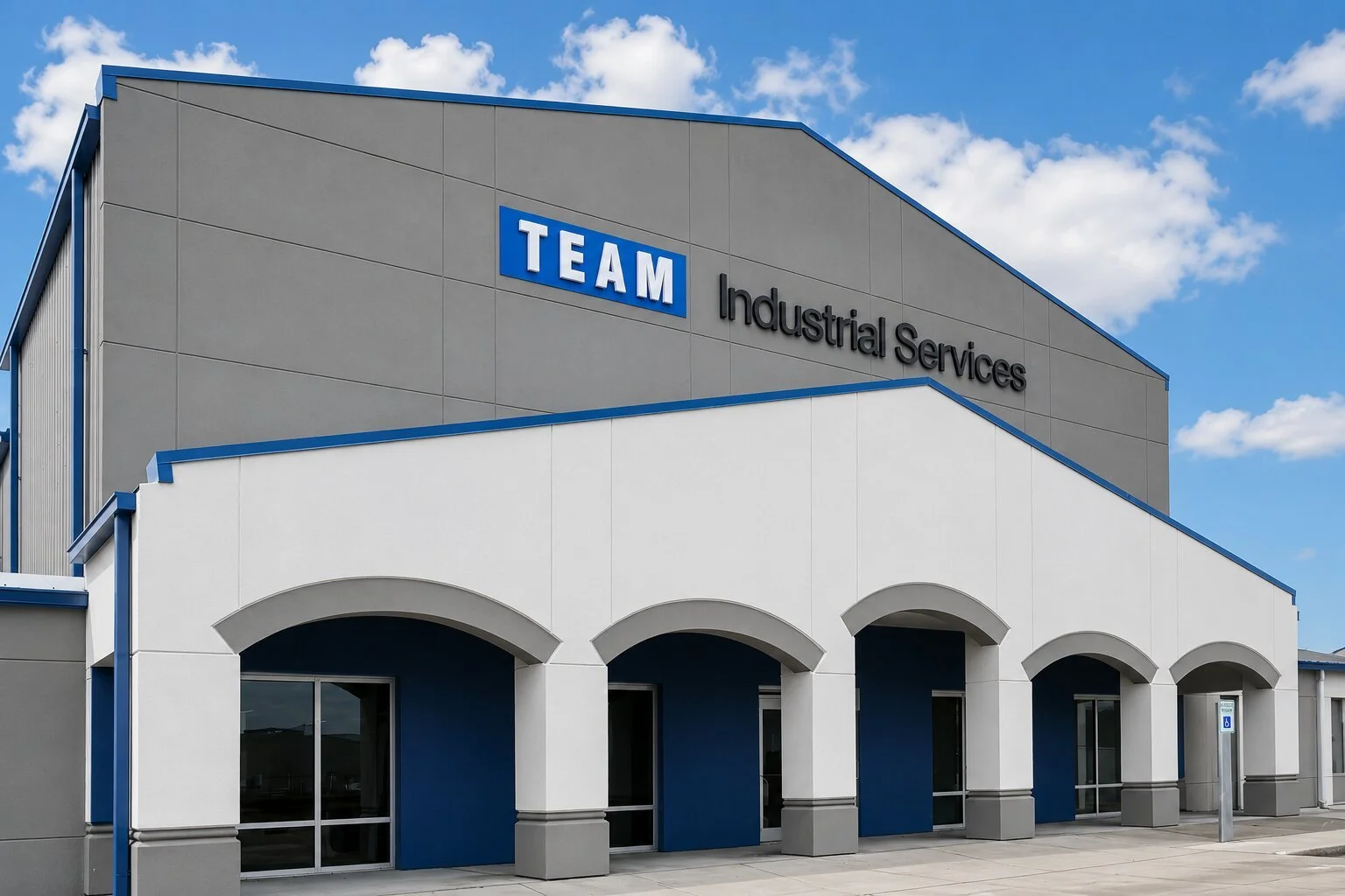 Exterior dimensional channel letter building sign installed on a modern commercial facility with corporate branding mounted above the main entrance.