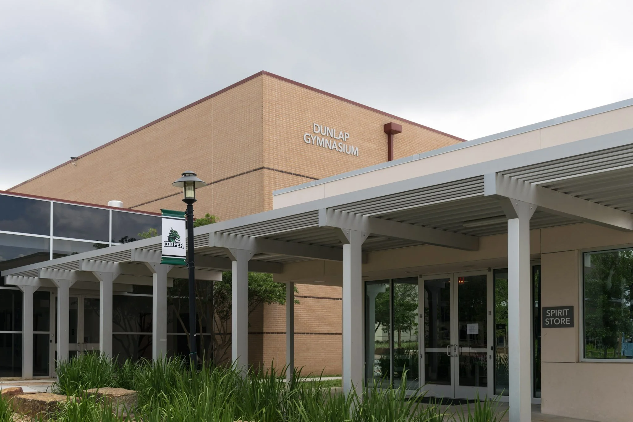 Exterior campus signage and architectural lettering installed at The John Cooper School in The Woodlands, Texas.