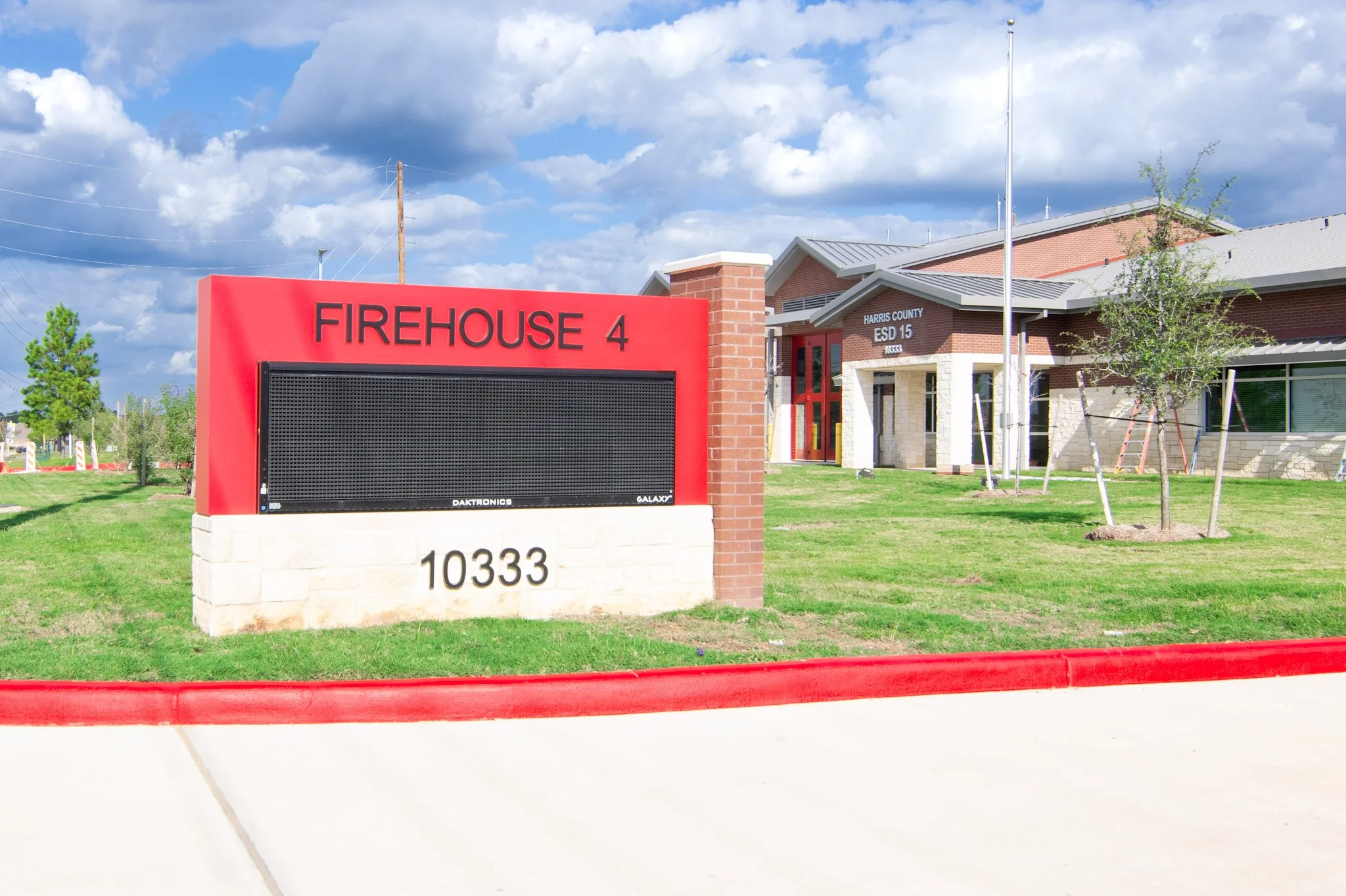 Digital monument sign installed at Harris County ESD 15 Firehouse 4 with electronic message display and masonry construction for facility identification.