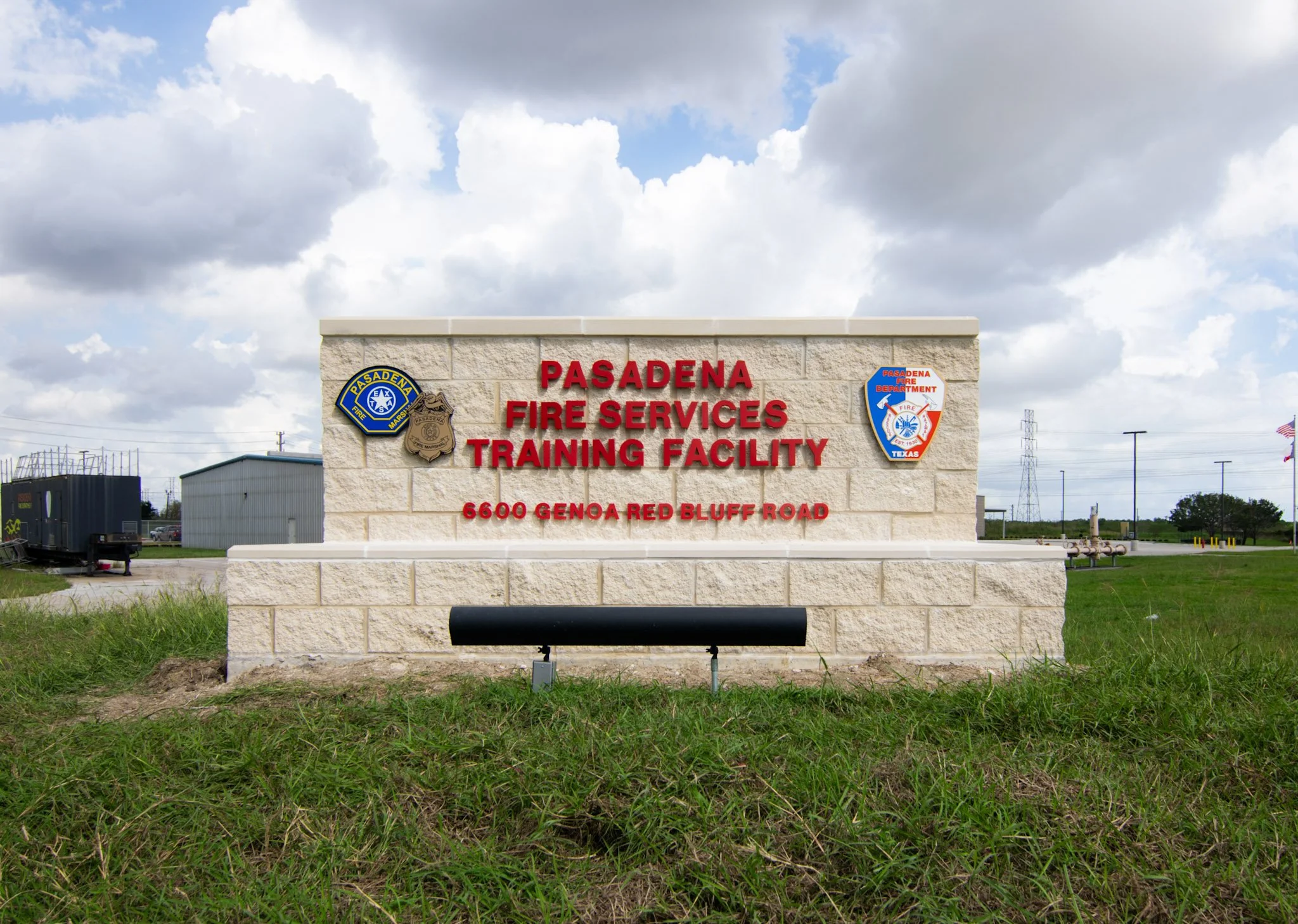 Stone monument sign with dimensional lettering installed at the Pasadena Fire Services Training Facility entrance, providing durable outdoor identification for the municipal campus.