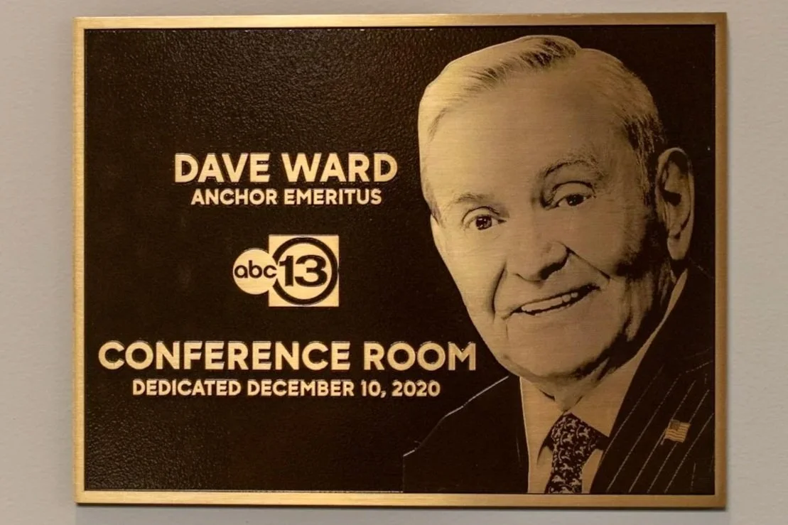 Bronze dedication plaque in Houston, honoring a distinguished figure.