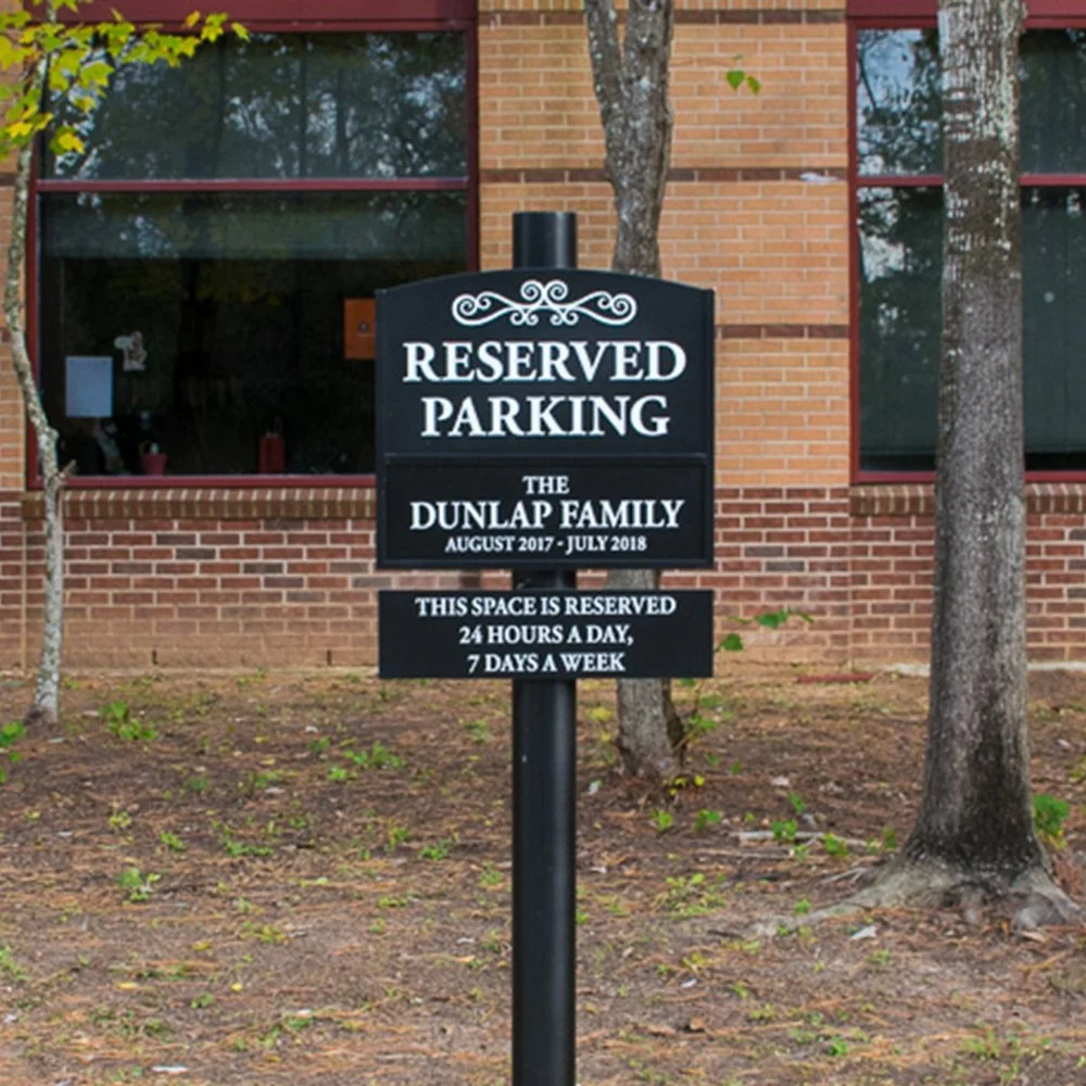Reserved parking signage for the Dunlap Family installed at The John Cooper School campus in The Woodlands, Texas.