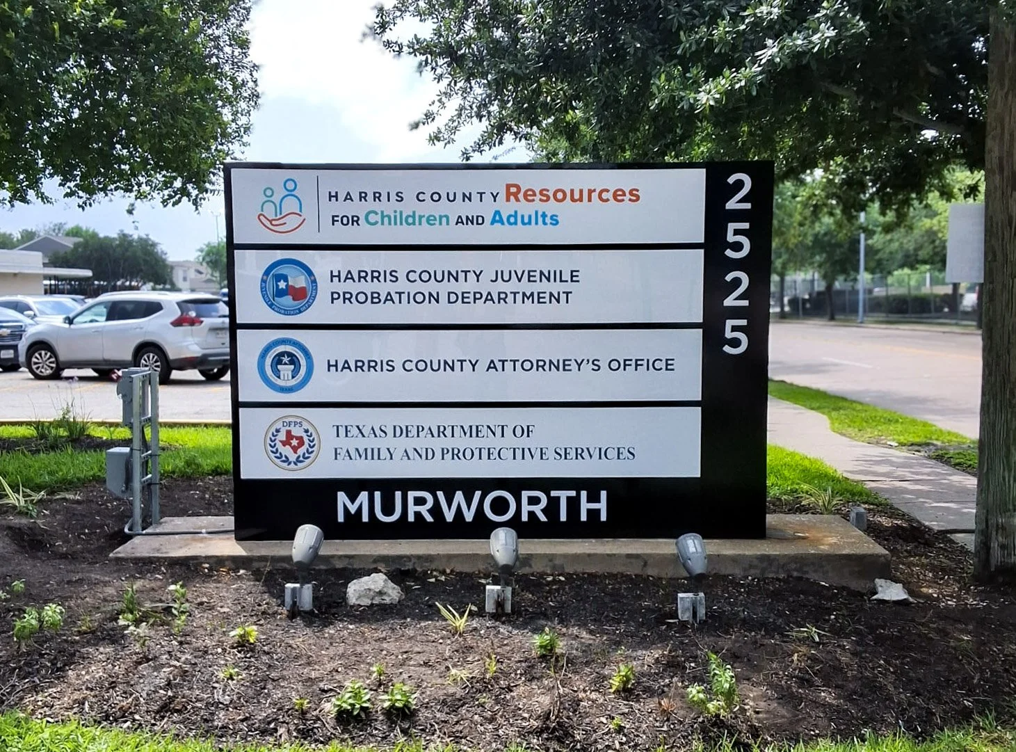 Murworth monument sign with tenant panels for Harris County Resources for Children and Adults, Harris County Juvenile Probation Department, Harris County Attorney's Office, and Texas Department of Family and Protective Services.