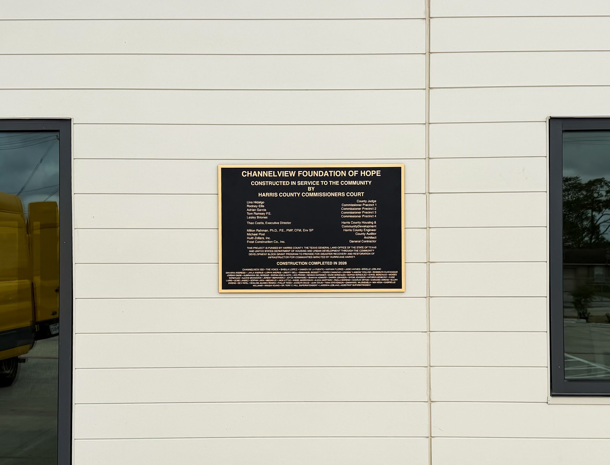 Custom commemorative plaque for the Channelview Foundation of Hope and Harris County Commissioners Court mounted on an exterior wall.