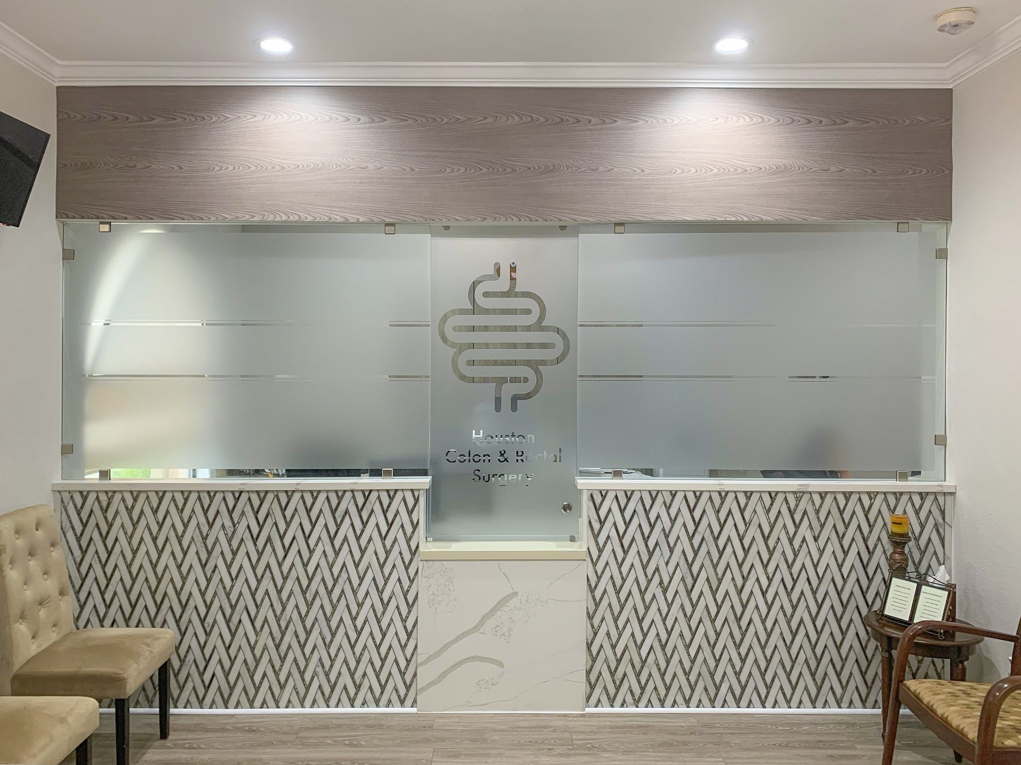 Frosted glass window graphics for a Houston medical office, combining privacy with a sophisticated design.