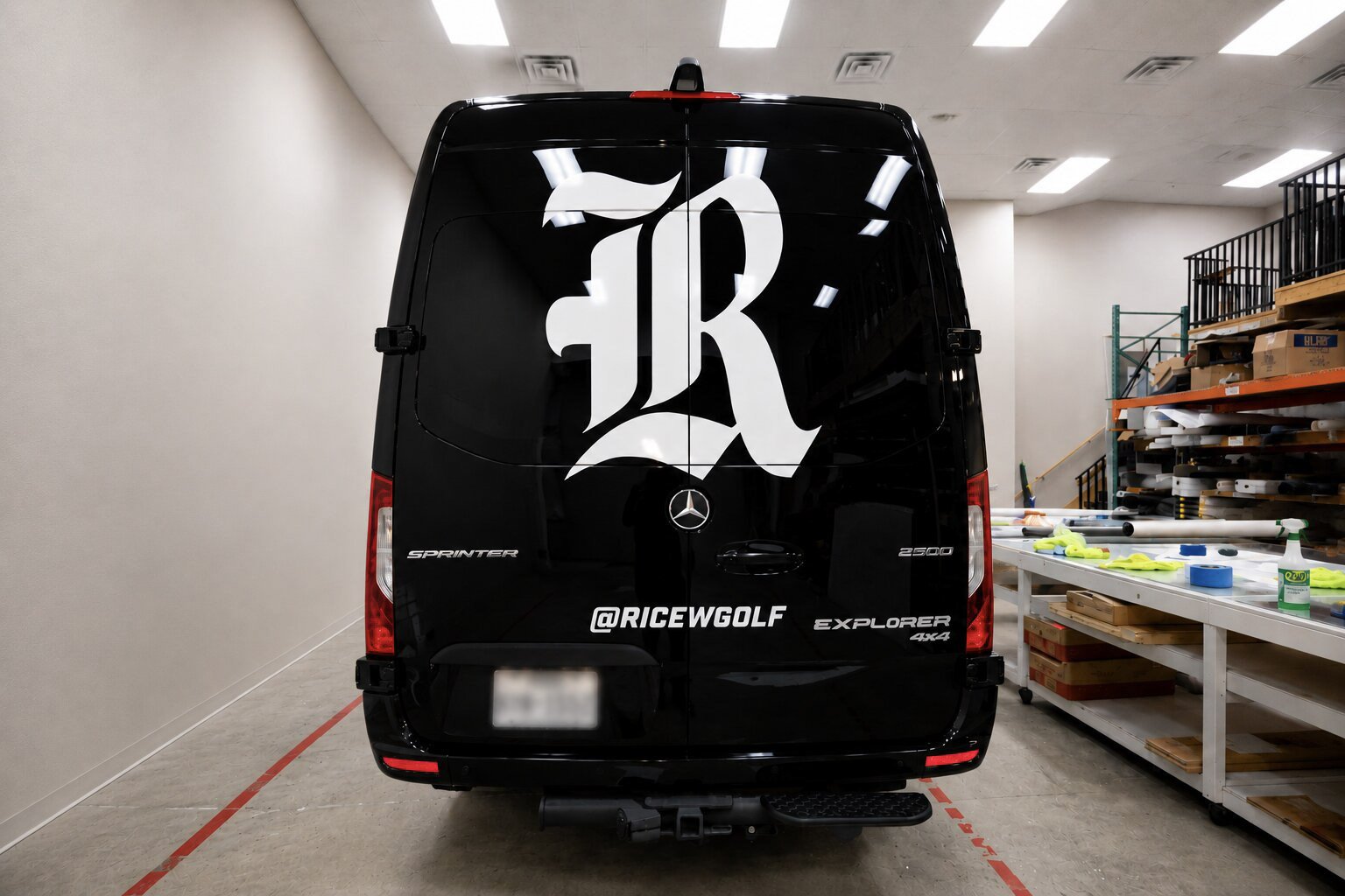 Rear view of a custom Rice University athletics van wrap featuring the Rice "R" logo and team branding, installed by Saifee Signs in Houston.