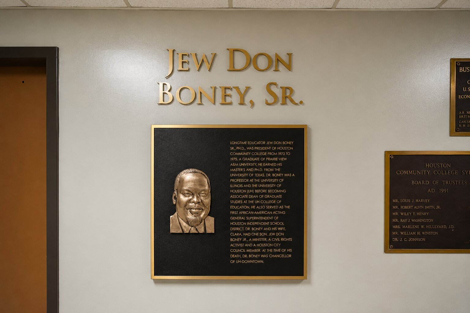 Bronze recognition plaque and dimensional lettering honoring Jew Don Boney Sr. installed on an interior wall at Houston Community College.