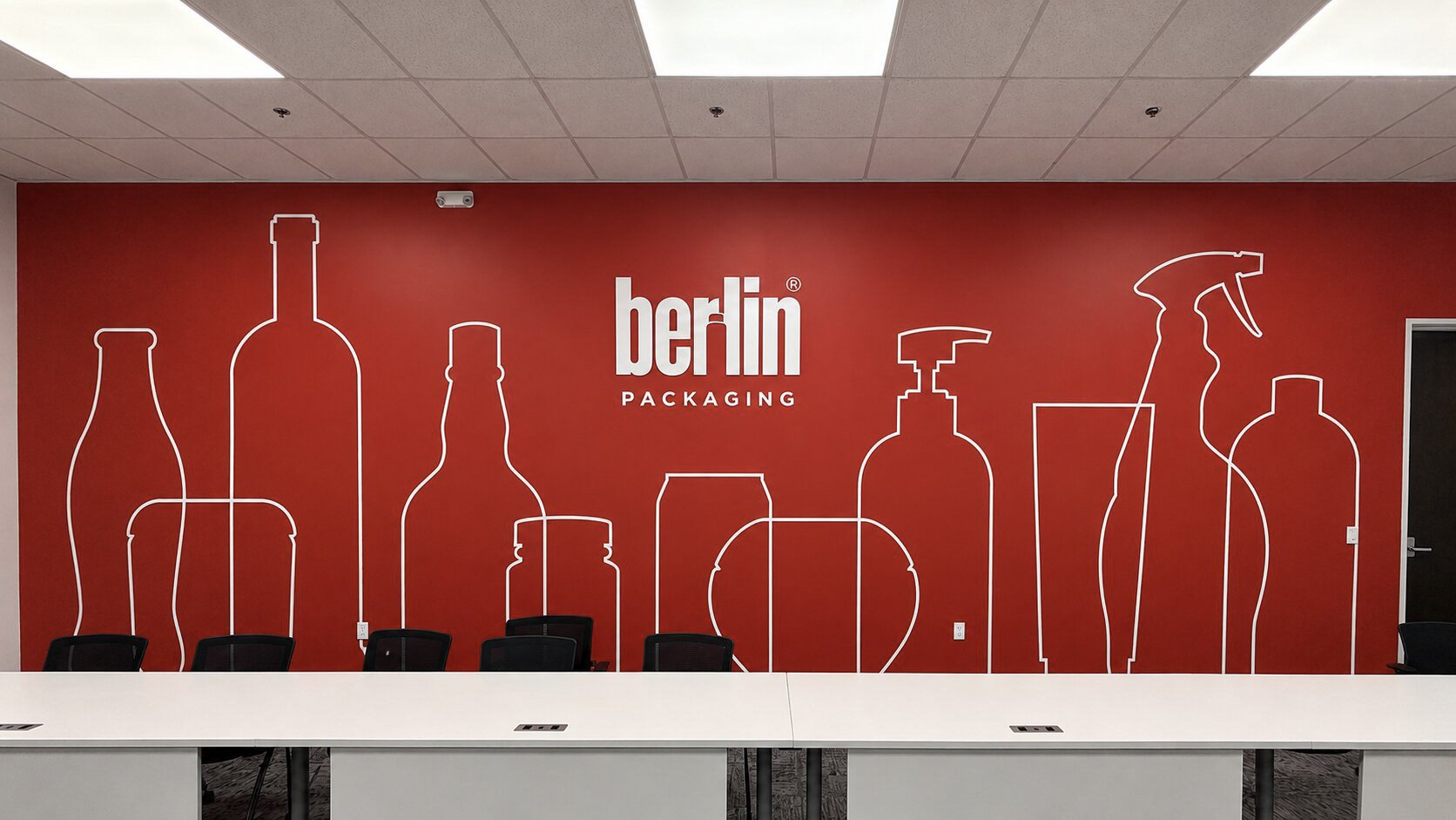 Large-format custom wall graphics installed by Saifee Signs, transforming an office interior with branded environmental graphics and bold corporate artwork.