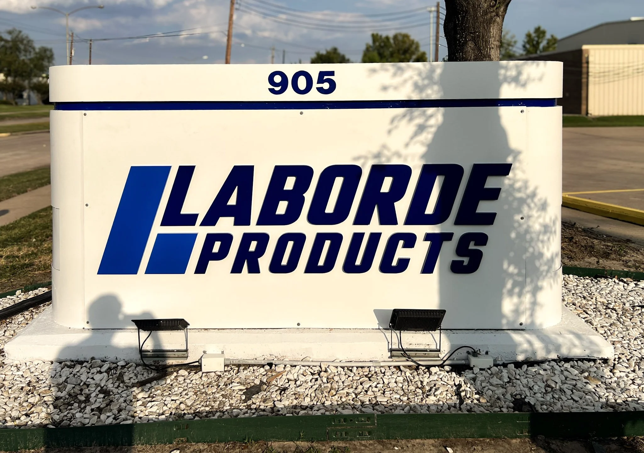Commercial monument sign with dimensional logo and lettering installed at the Laborde Products facility entrance for business identification.