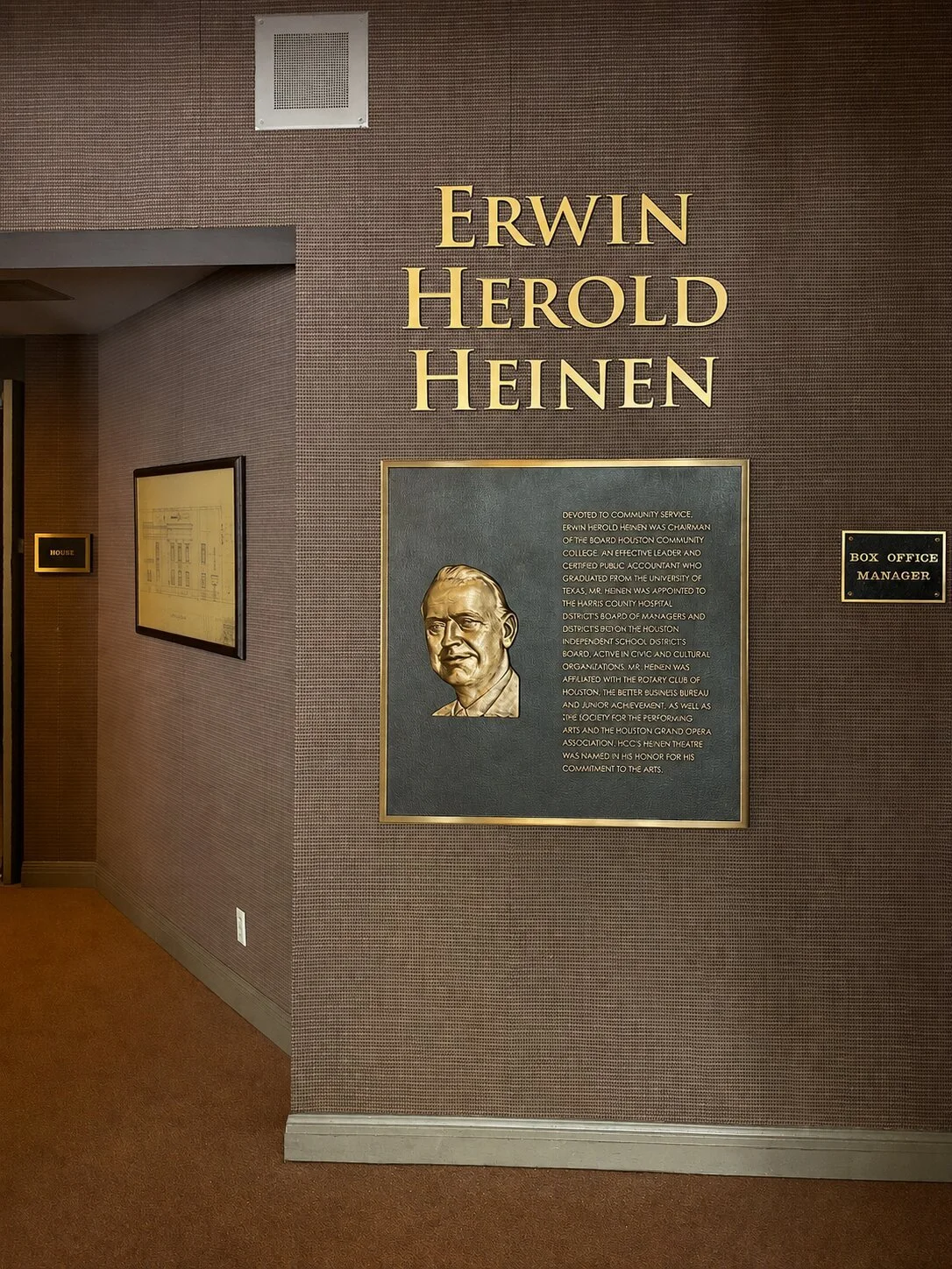 Bronze recognition plaque with raised portrait and dimensional lettering honoring Erwin Herold Heinen at Houston Community College.