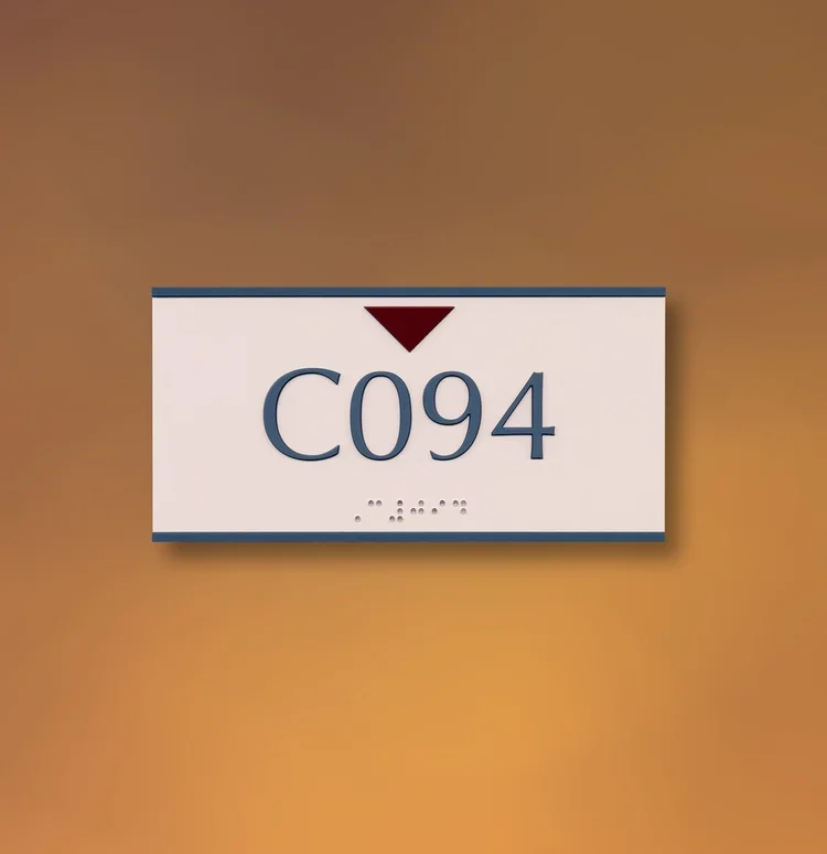 Standard ADA room identification sign reading C094 with tactile lettering and Braille, used for interior wayfinding in Houston.