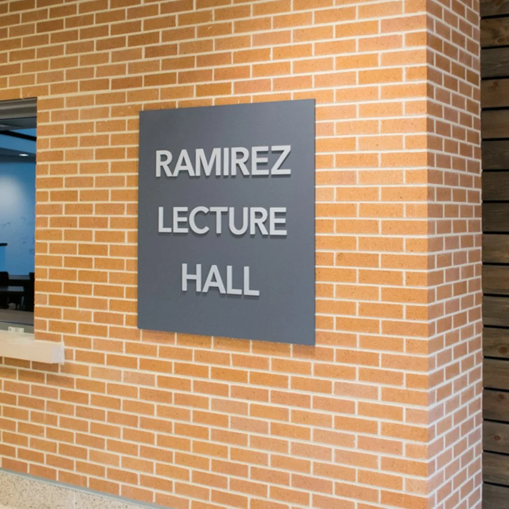 Custom lecture hall dimensional lettering signage for RAMIREZ LECTURE HALL at The John Cooper School in The Woodlands, Texas.