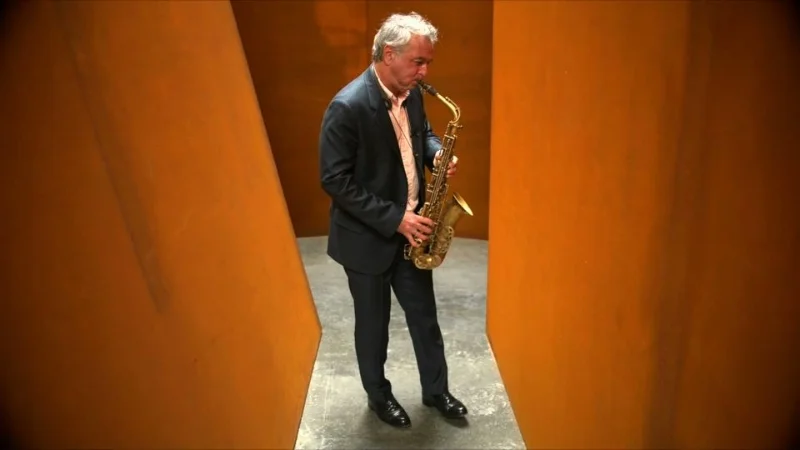 Fefer enjoys a moment of intense focus, moved by the beauty of sculptural resonance within Serra's NJ-1. Photo by Nina Roberts
