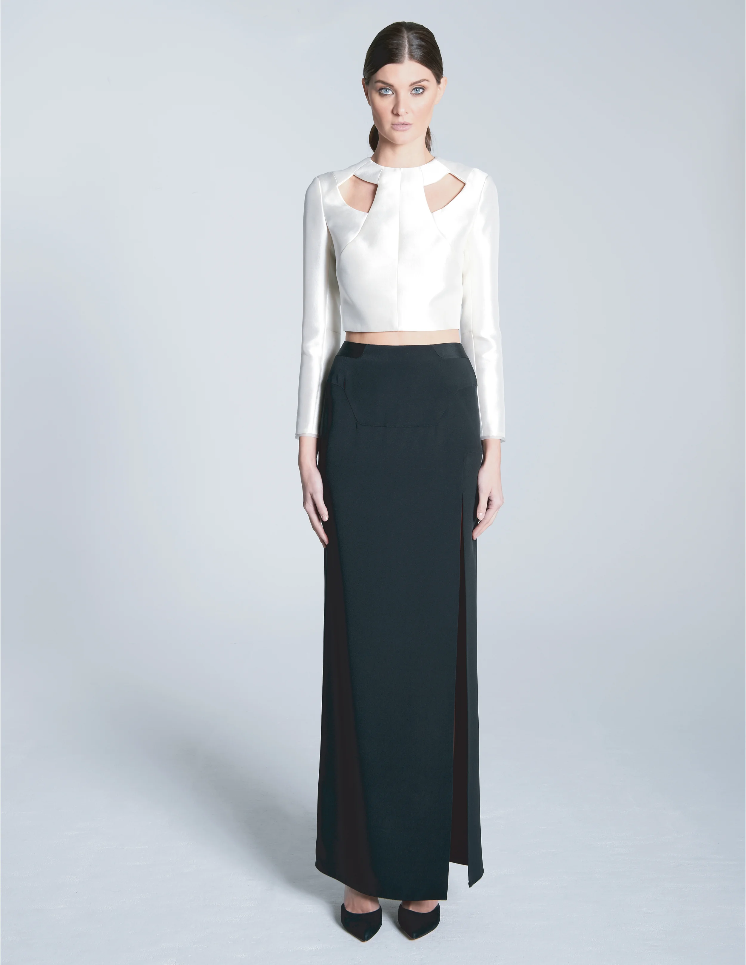 CALLISTO TOP 51% silk / 49% wool with 100% silk organza tipping. fully lined in 100% silk charmeuse. separating invisible zip closure at center back. invisible zip closure at sleeve openings. THALASSA SKIRT 100% silk 4-ply crepe. partially lined in 100% silk charmeuse. invisible zip closure at center back.