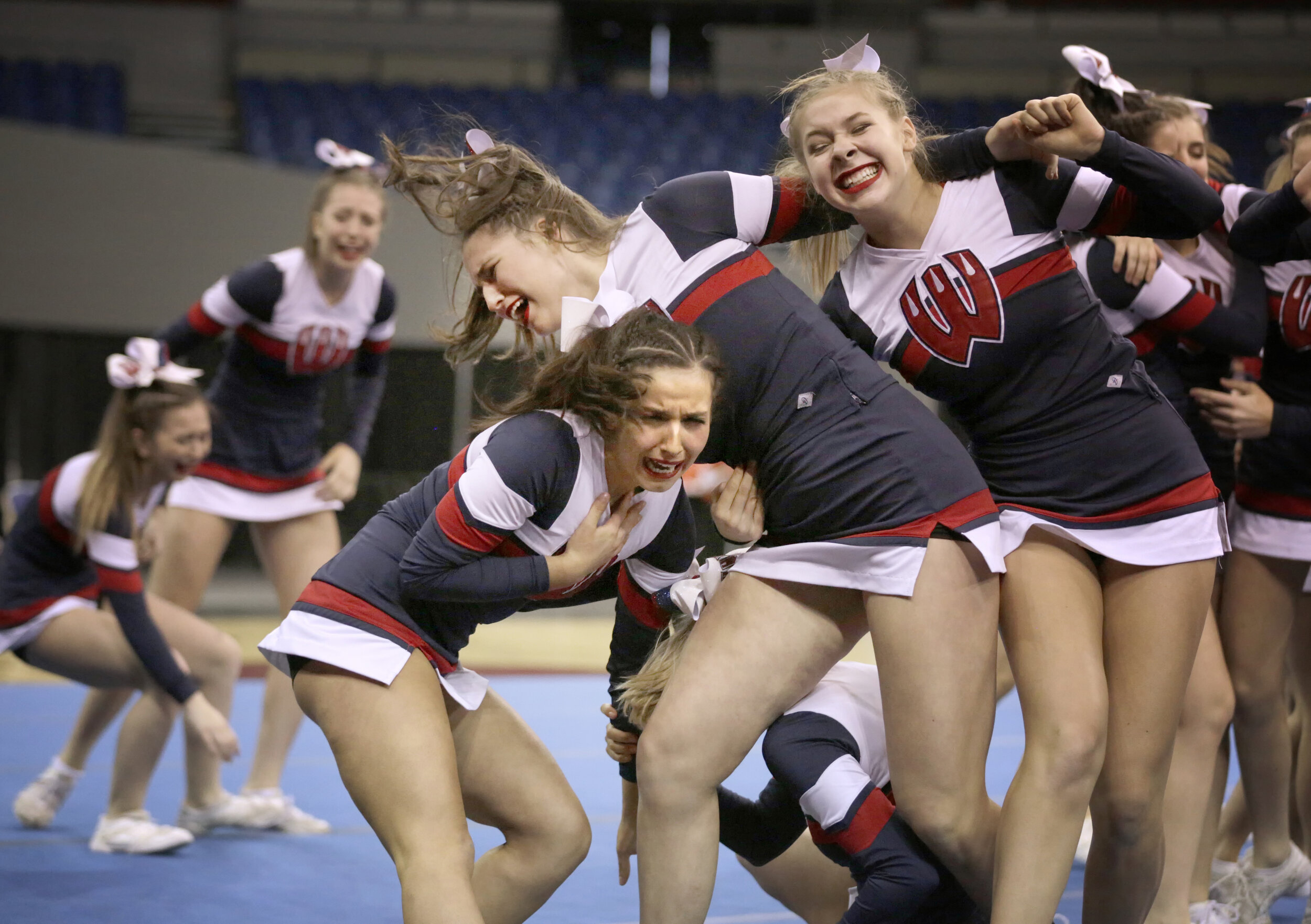 Westview cheerleaders celebrate after their strong routine during the OSAA State Cheerleading Championships. The Wildcats went on to take first place in the 6A category.
