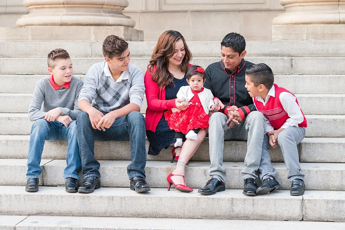 family portraits vintage courthouse white columns marble entry red gray black outfits_0328.jpg