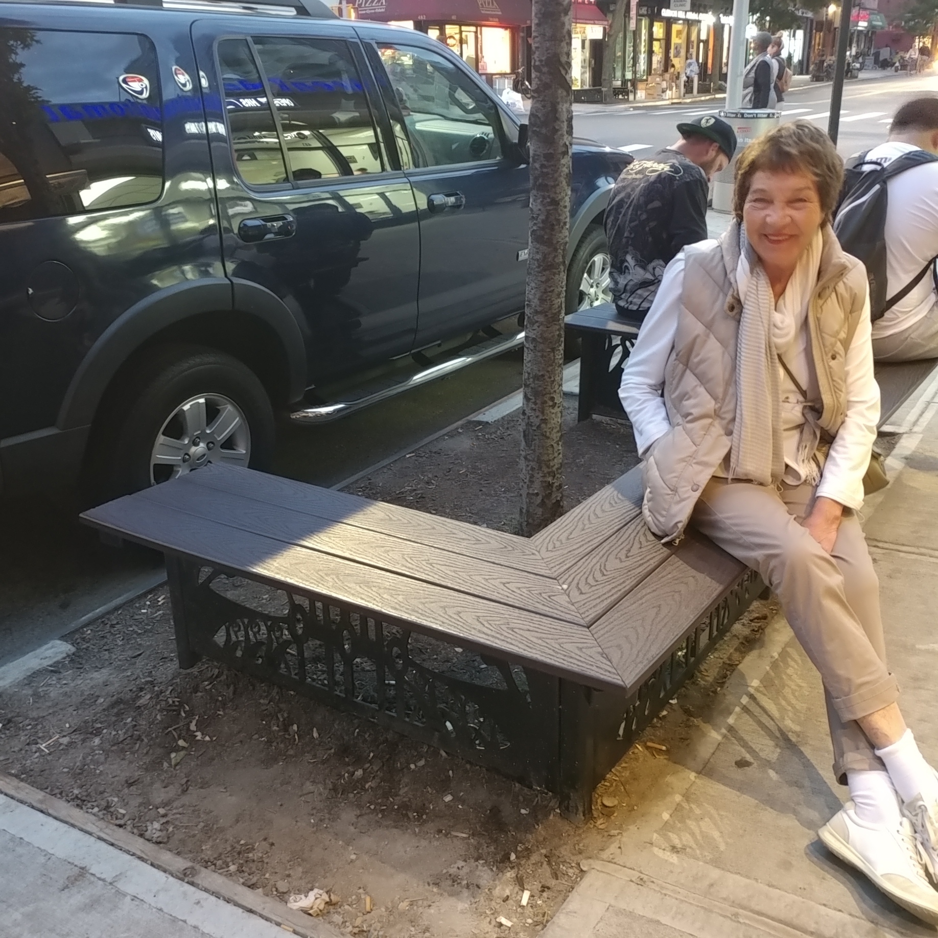 My mom proudly sitting on my bench! 