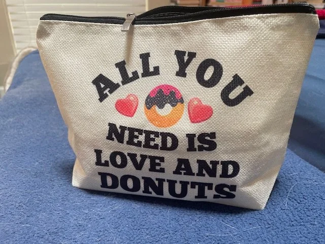 makeup bag, love and a donut