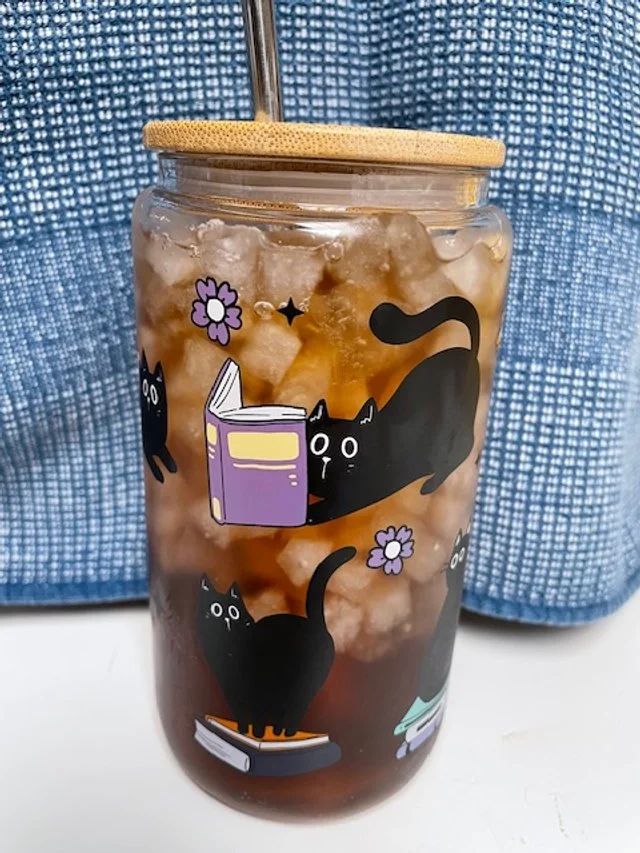 reading cats drinking glass with straw