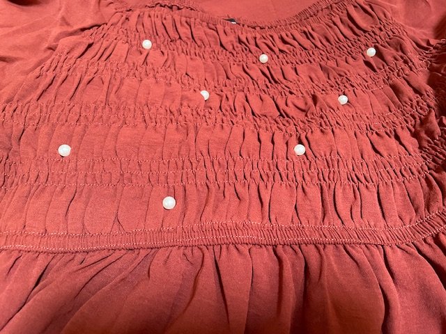 rust red dress with pearls