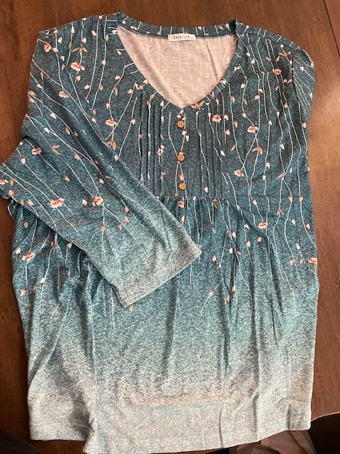 teal 3/4 sleeve knit shirt, pleated and floral