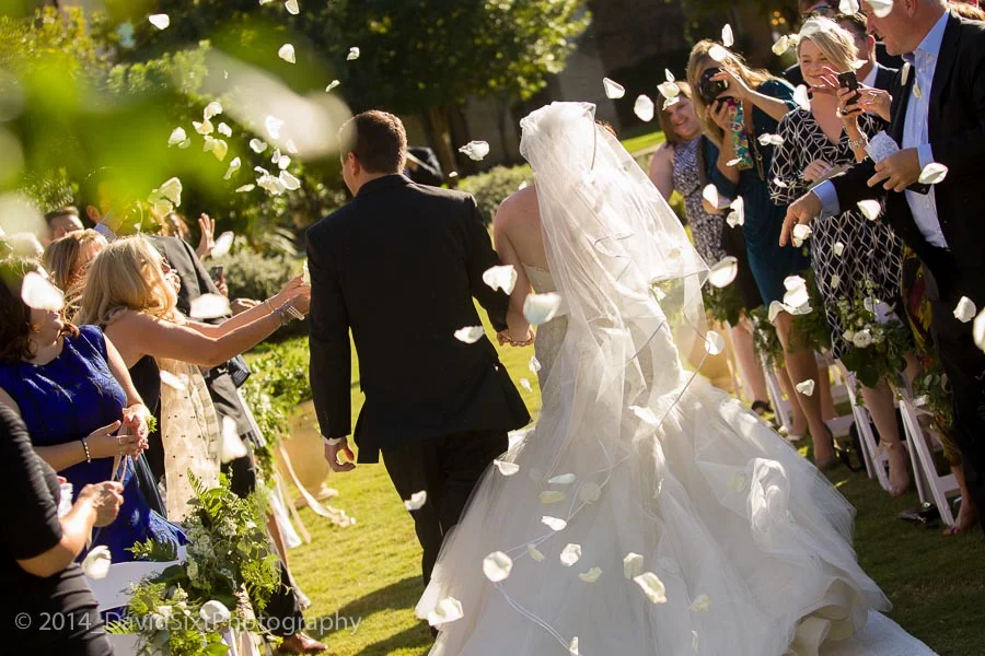 petal toss during the recessional, and the mother of the bride said, "everyone love to throw things at the bride and groom." :)