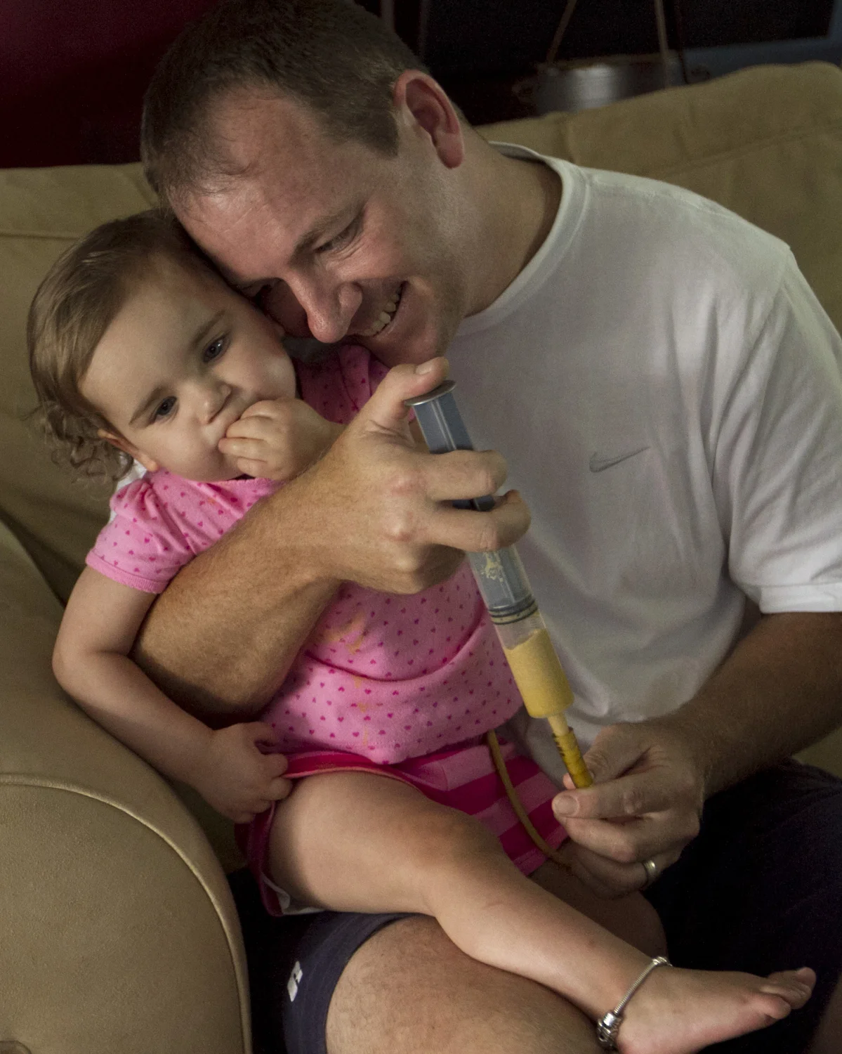  Carolena Long is fed through a feeding tube by her father Kevin at their home in Fort Myers. Carolena has Heterotaxy Syndrome, which affects her heart and other organs and causes gastrointestinal problems. 
