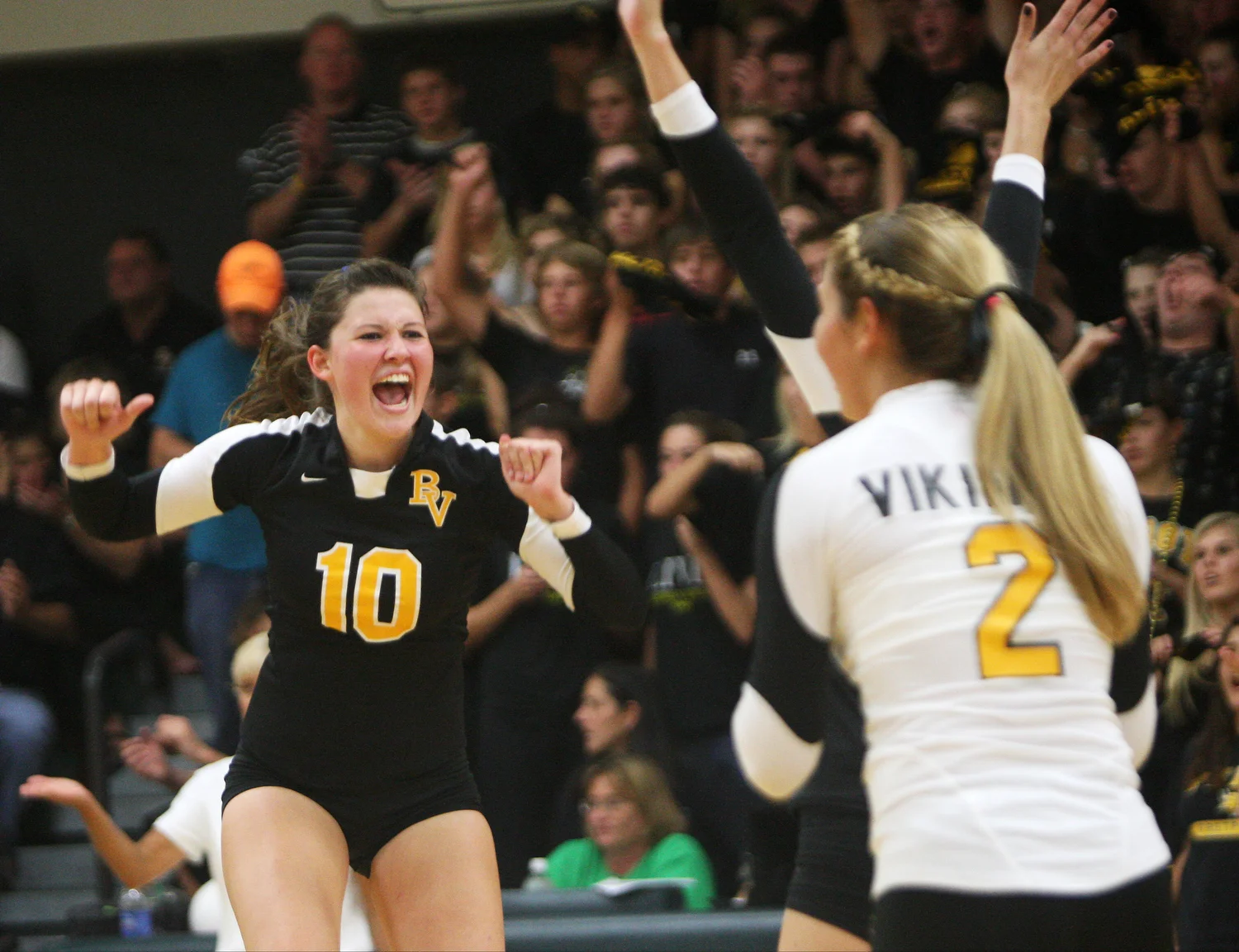  Ciara Brown of Bishop Verot celebrates a point with her teammates during a volleyball game against Fort Myers High School. 