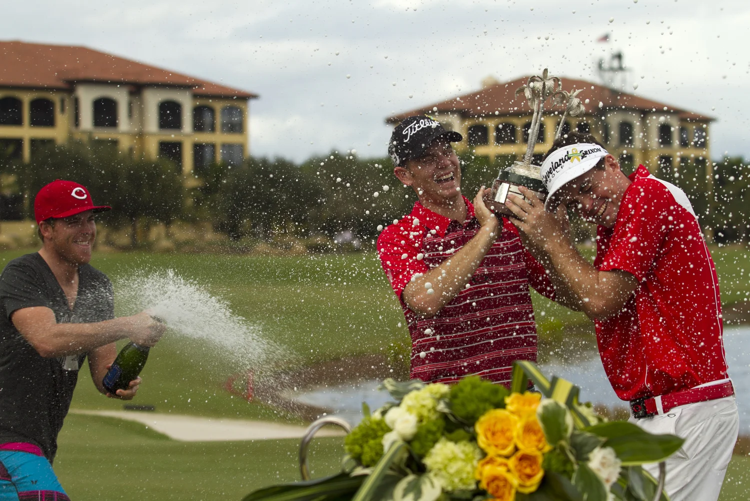  Champions Tour golfer Luke List, left, sprays Brendan Steele, center, and Keegan Bradley with champagne after they won the Franklin Templeton Shootout. They finished at 32 under par. 